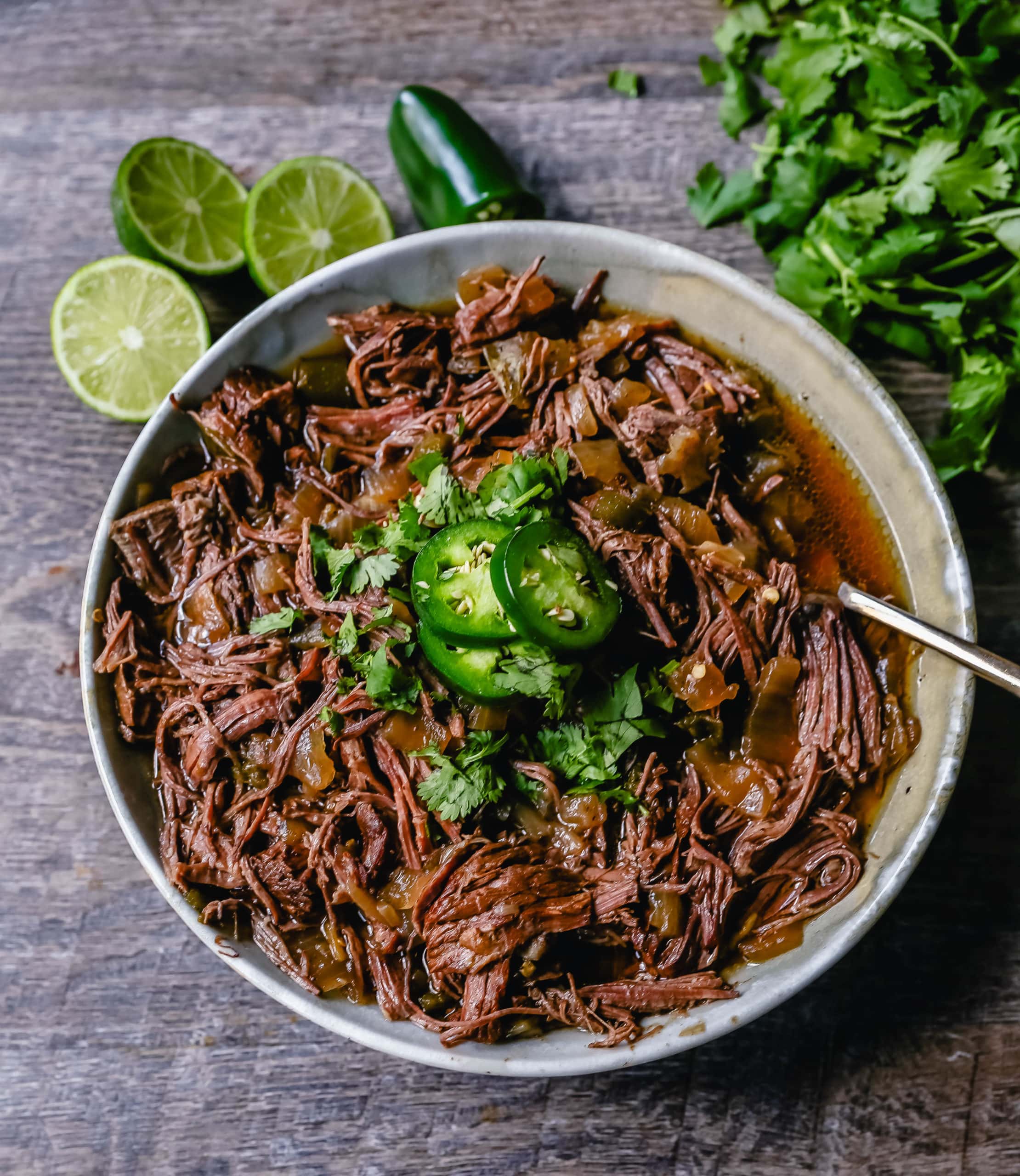 Slow Cooker Barbacoa Beef Tender, flavorful, slow-cooked beef with onions, jalapenos, and spices make this the perfect barbacoa beef for burritos, tacos, enchiladas, quesadillas, on a salad, or just on its own with a few side dishes. 