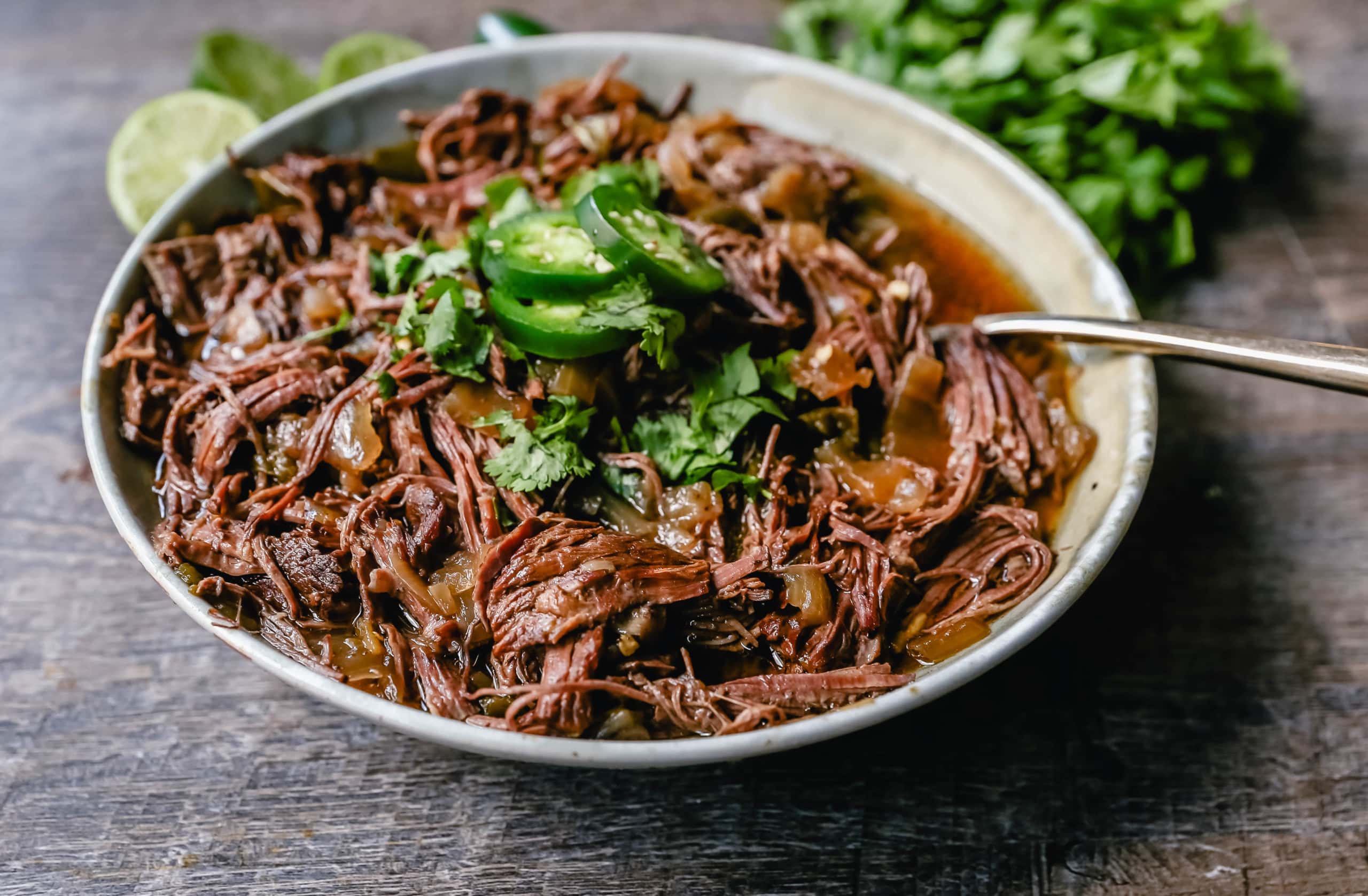 Slow Cooker Barbacoa Beef Tender, flavorful, slow-cooked beef with onions, jalapenos, and spices make this the perfect barbacoa beef for burritos, tacos, enchiladas, quesadillas, on a salad, or just on its own with a few side dishes. 