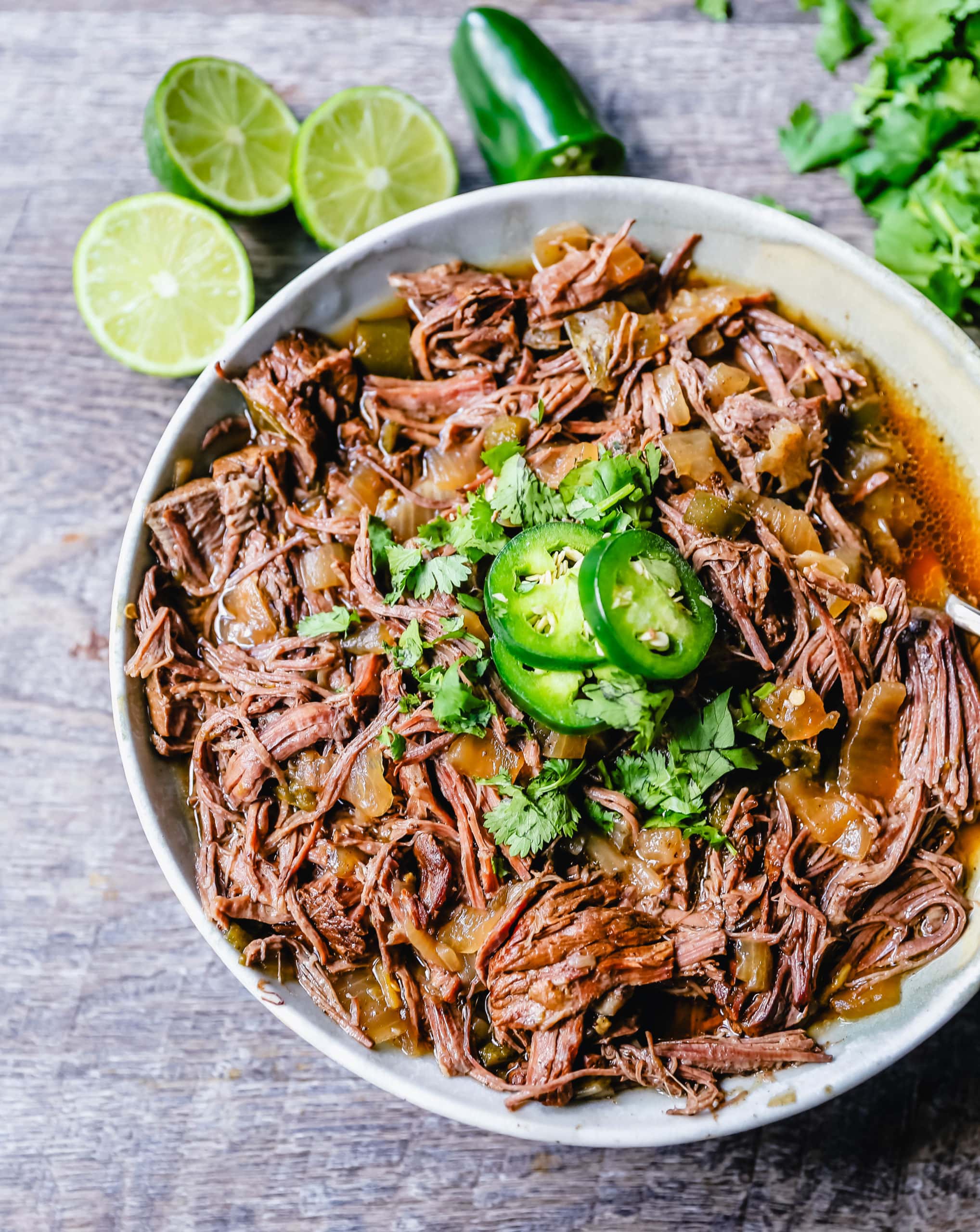 Slow Cooker Barbacoa Beef Tender, flavorful, slow-cooked beef with onions, jalapenos, and spices make this the perfect barbacoa beef for burritos, tacos, enchiladas, quesadillas, on a salad, or just on its own with a few side dishes. 