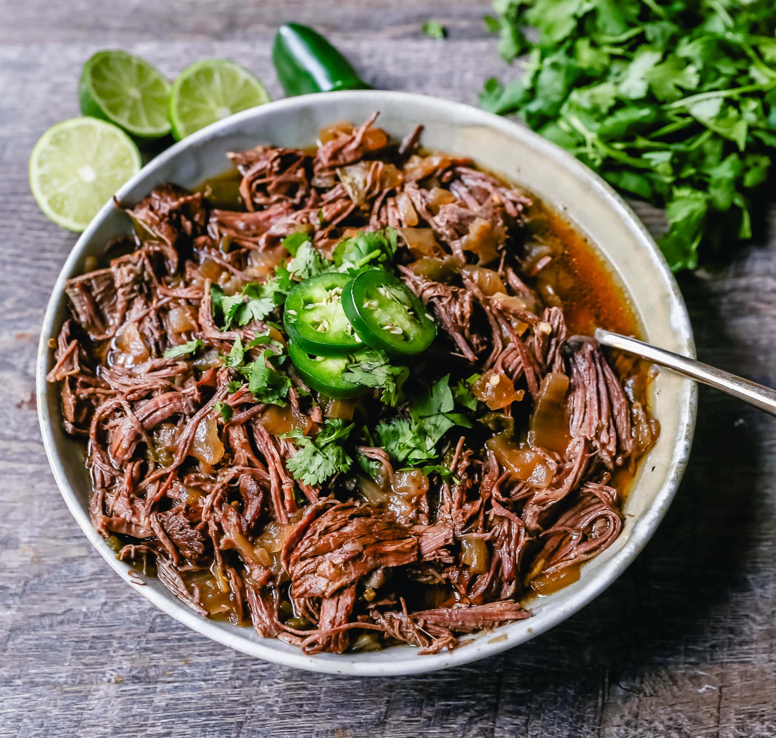 Slow Cooker Barbacoa Beef Tender, flavorful, slow-cooked beef with onions, jalapenos, and spices make this the perfect barbacoa beef for burritos, tacos, enchiladas, quesadillas, on a salad, or just on its own with a few side dishes. 