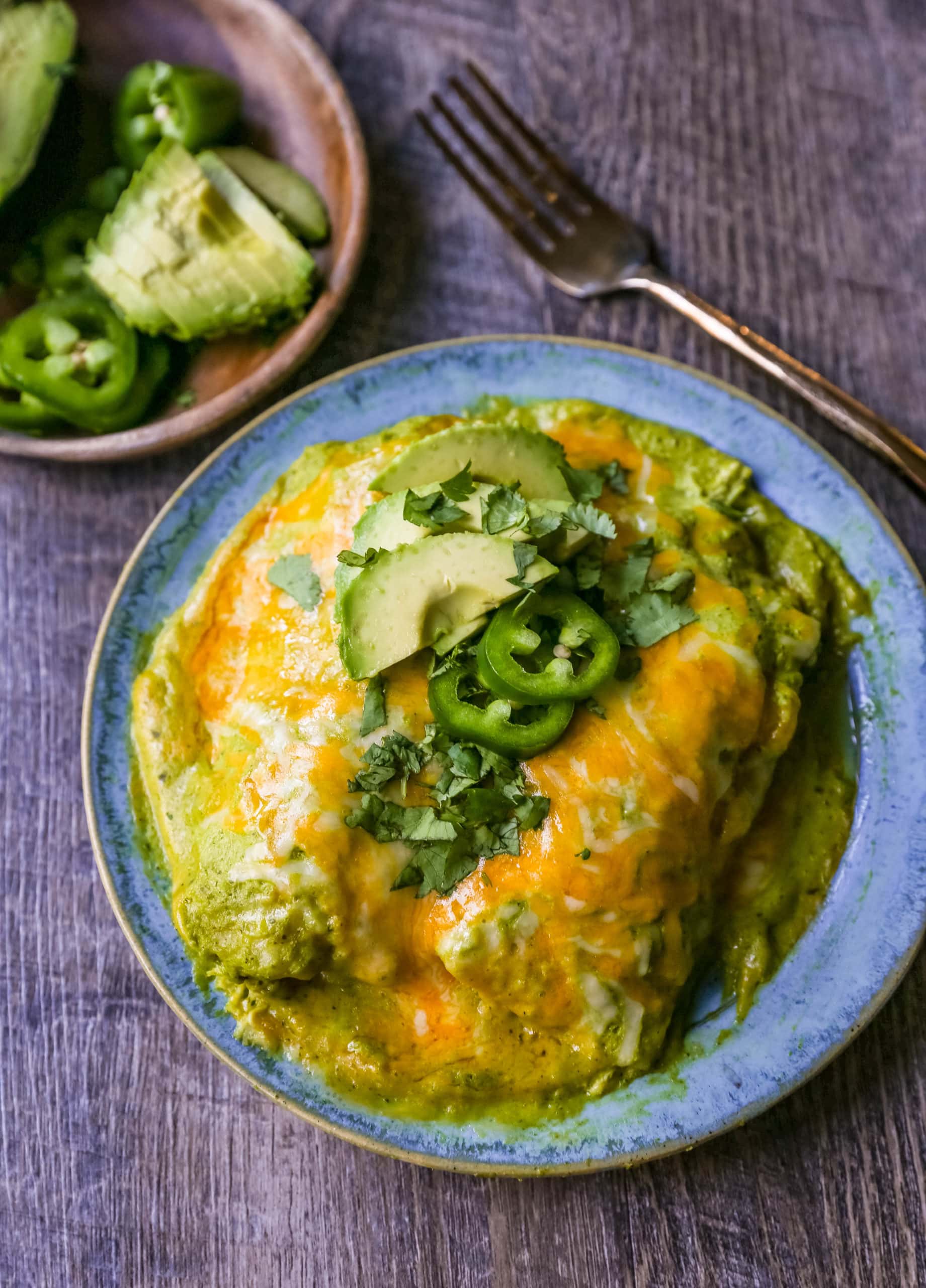 Chicken Enchiladas Suizas Creamy chicken enchiladas in a homemade tomatillo poblano sauce and baked with Mexican cheeses until bubbly. 