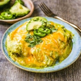 Chicken Enchiladas Suizas Creamy chicken enchiladas in a homemade tomatillo poblano sauce and baked with Mexican cheeses until bubbly.