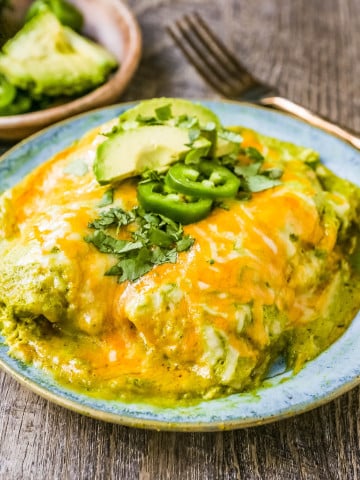 Chicken Enchiladas Suizas Creamy chicken enchiladas in a homemade tomatillo poblano sauce and baked with Mexican cheeses until bubbly. 