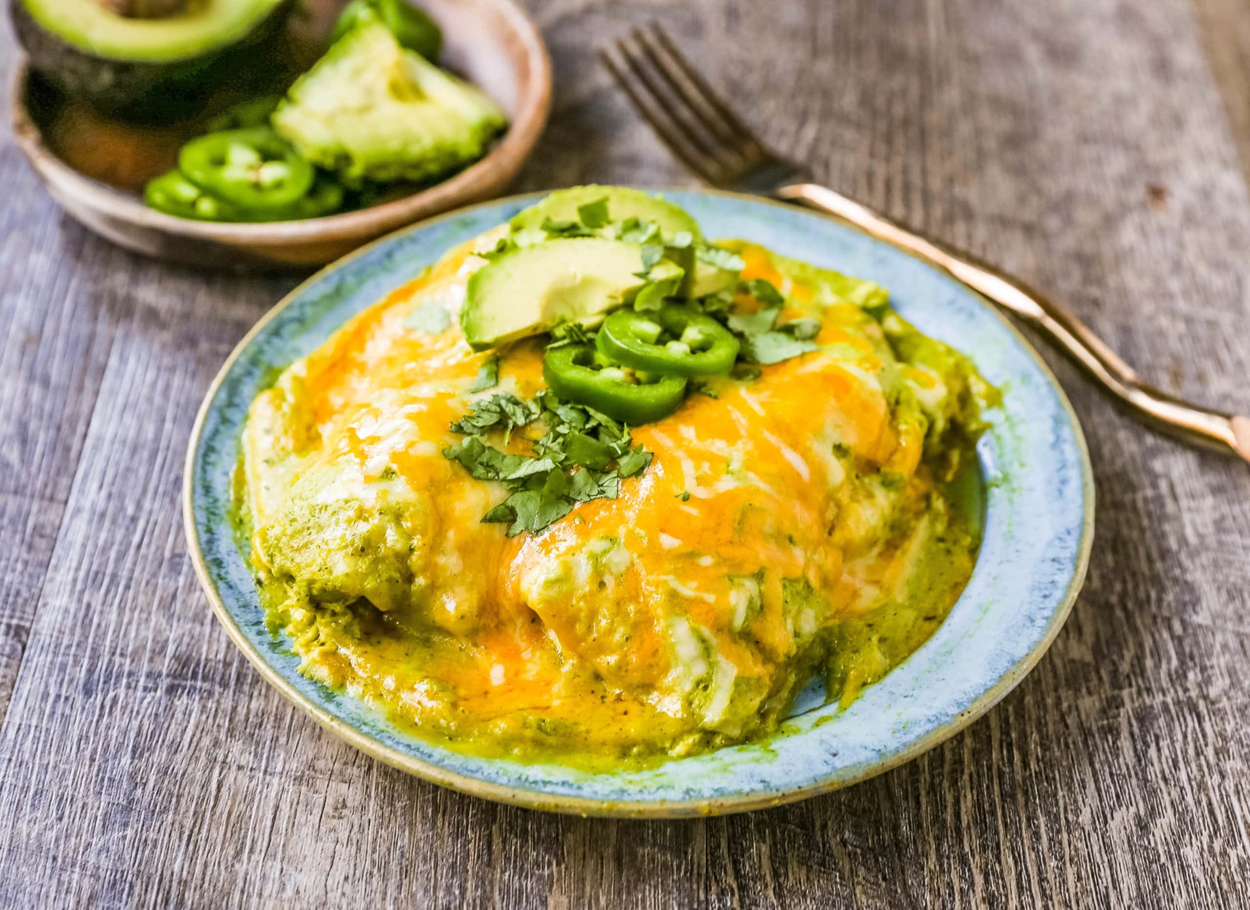 Chicken Enchiladas Suizas Creamy chicken enchiladas in a homemade tomatillo poblano sauce and baked with Mexican cheeses until bubbly. 