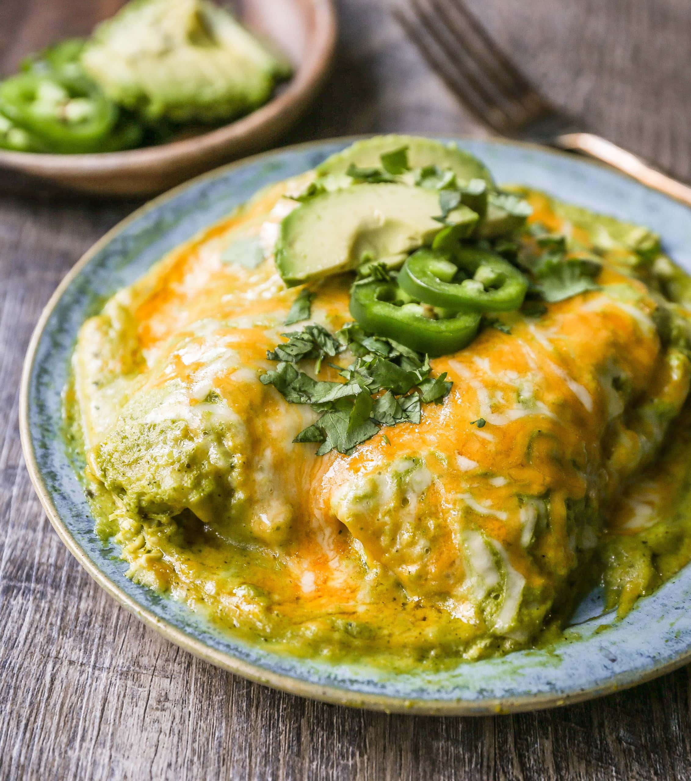 Chicken Enchiladas Suizas Creamy chicken enchiladas in a homemade tomatillo poblano sauce and baked with Mexican cheeses until bubbly. 