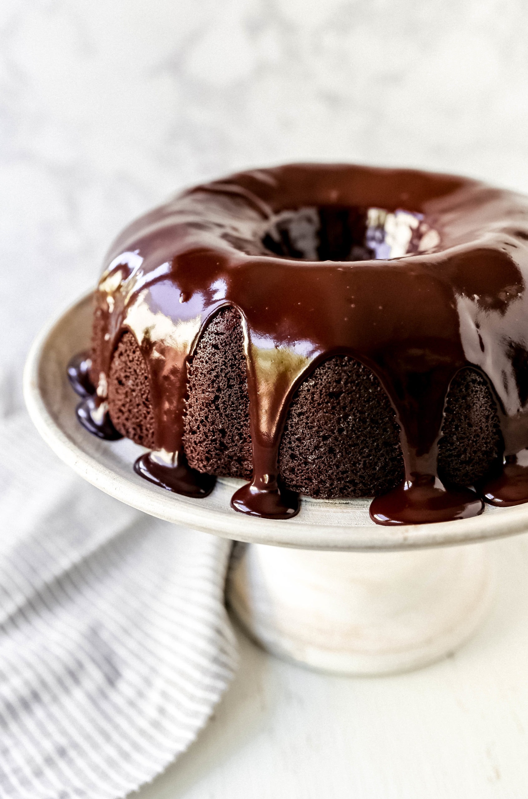 The Best Chocolate Bundt Cake Moist, decadent, rich chocolate bundt cake with a silky chocolate glaze. How to make the perfect chocolate bundt cake recipe! #chocolate #bundtcake #chocolatebundtcake #chocolatecake #cake