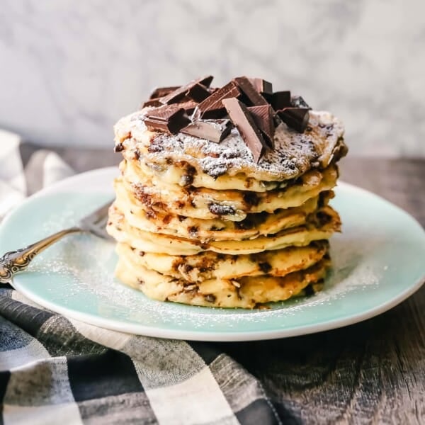 Chocolate Chip Ricotta Pancakes Creamy homemade one-bowl ricotta pancakes with chocolate chips. How to make easy 5-minute chocolate chip ricotta pancakes from scratch! www.modernhoney.com #ricottapancakes #pancakes #chocolatechipricottapancakes