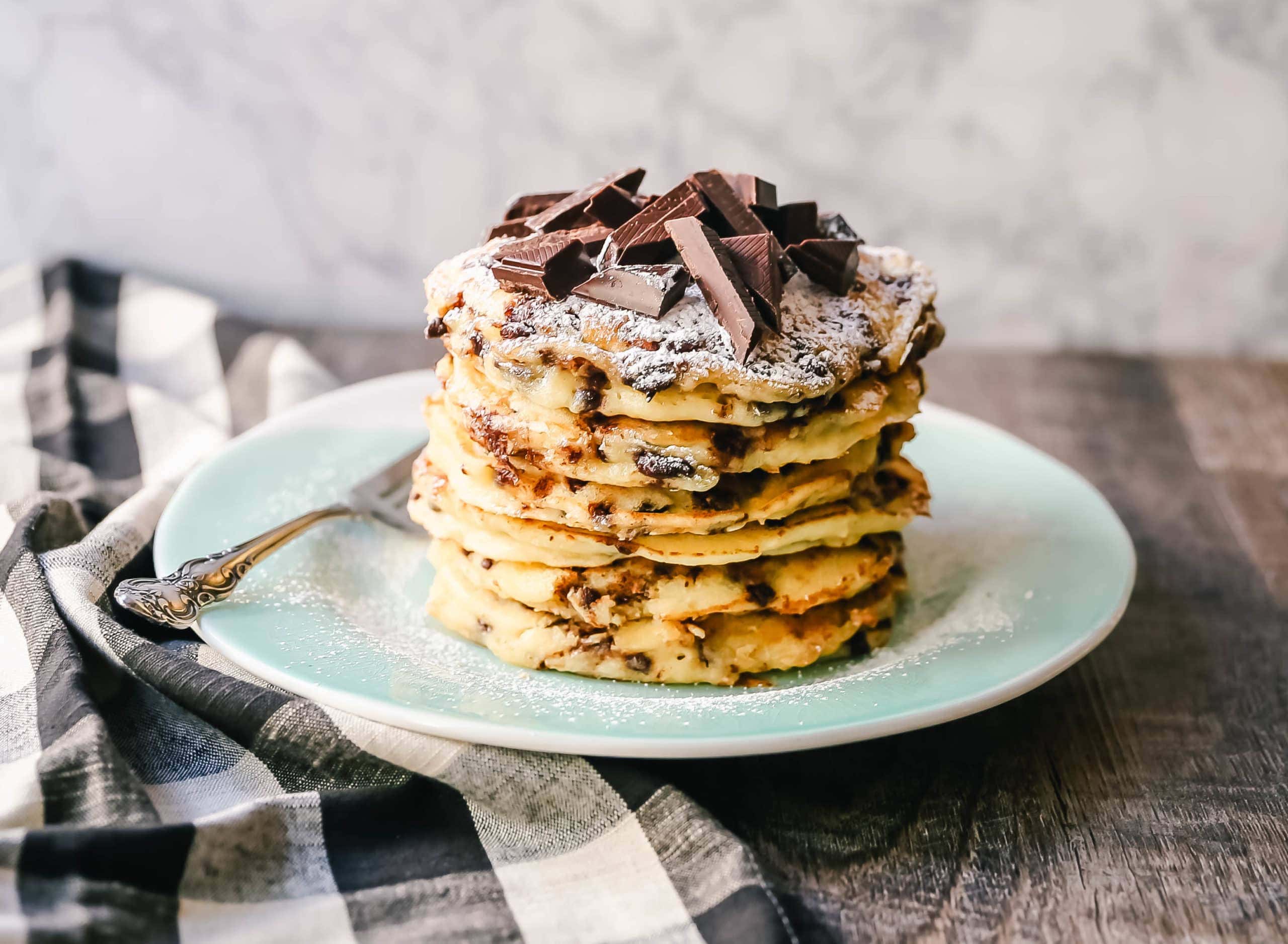 Chocolate Chip Ricotta Pancakes Creamy homemade one-bowl ricotta pancakes with chocolate chips. How to make easy 5-minute chocolate chip ricotta pancakes from scratch! www.modernhoney.com #ricottapancakes #pancakes #chocolatechipricottapancakes