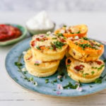 Mini Egg Bacon and Cheese Bites A quick and easy bite-size high-protein and low-carb breakfast. These mini egg bites are the perfect start for your day! www.modernhoney.com #eggbites #eggbaconbites #breakfast