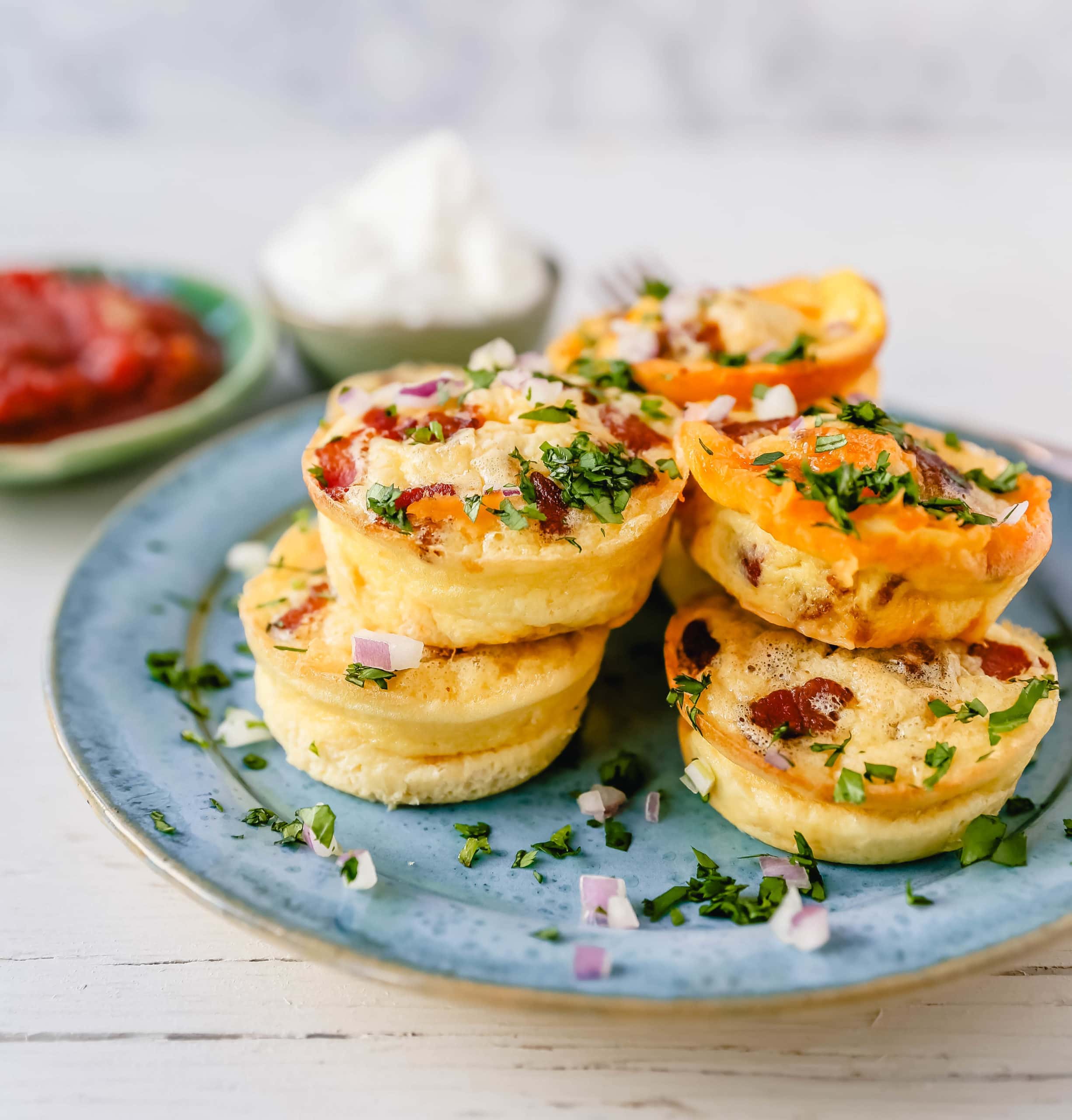 Mini Egg Bacon and Cheese Bites A quick and easy bite-size high-protein and low-carb breakfast. These mini egg bites are the perfect start for your day! www.modernhoney.com #eggbites #eggbaconbites #breakfast