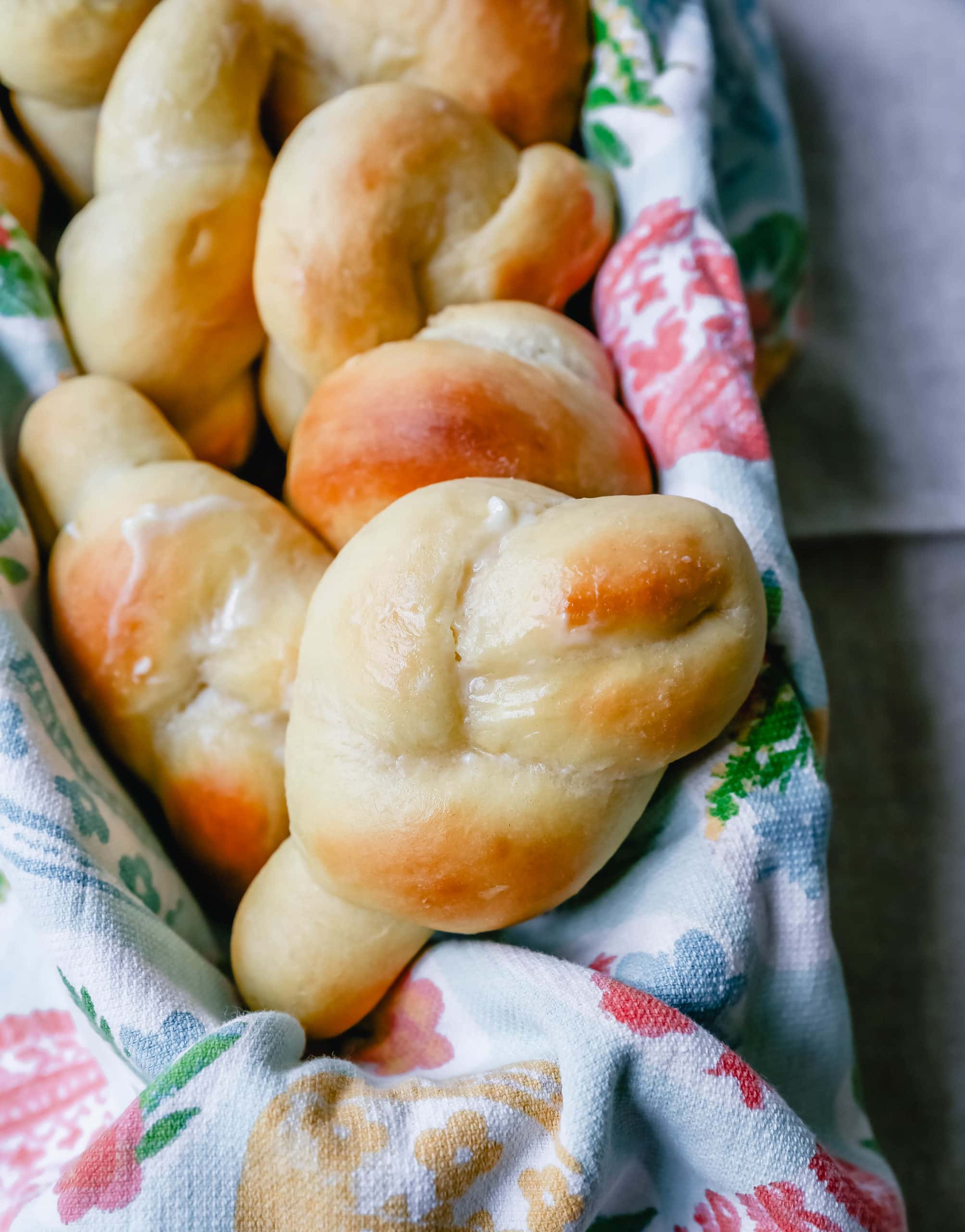 Homemade Knotted Rolls Buttery, fluffy homemade rolls tied in knot and brushed with butter. The perfect knotted rolls recipe! www.modernhoney.com #rolls #easter #dinnerrolls #knottedrolls