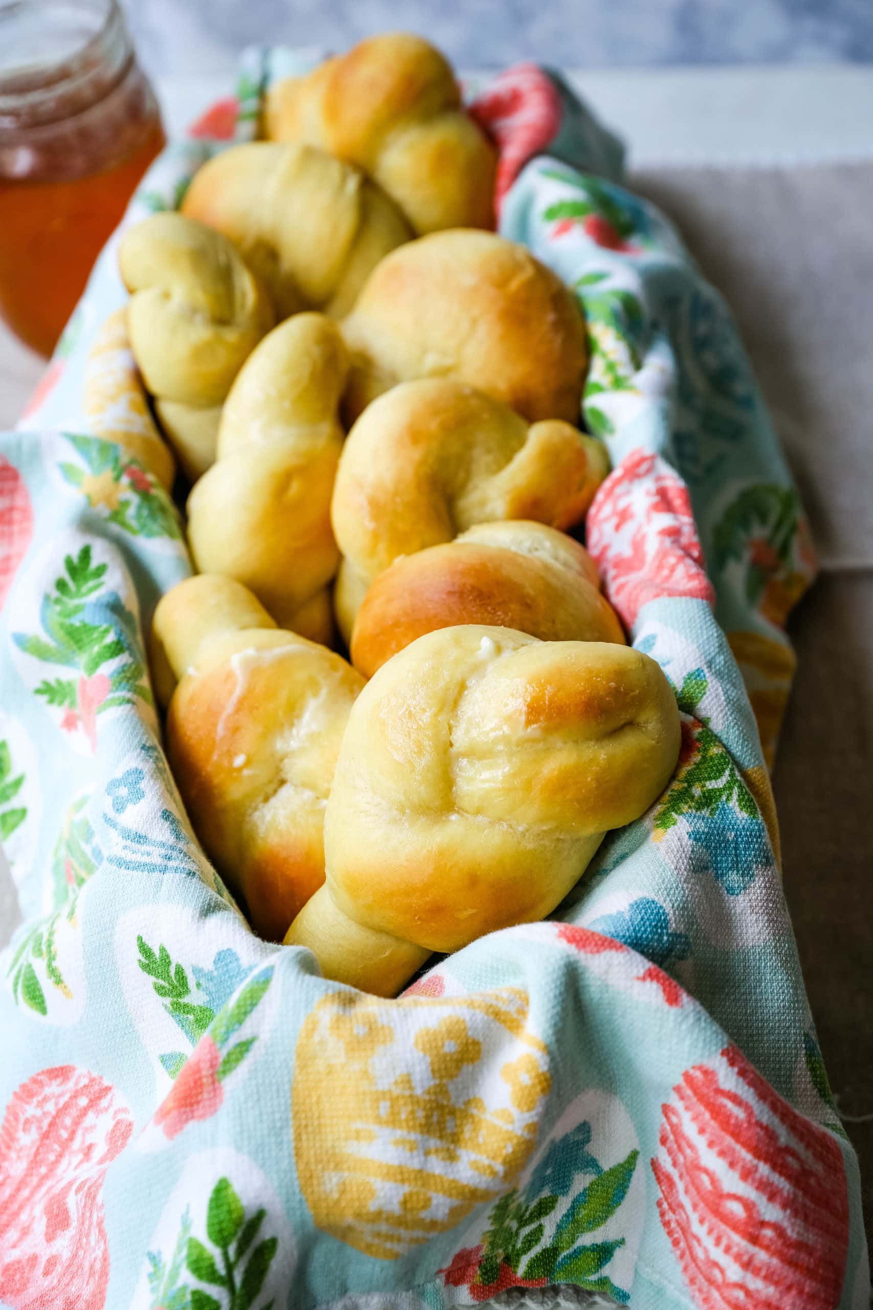 Homemade Knotted Rolls Buttery, fluffy homemade rolls tied in knot and brushed with butter. The perfect knotted rolls recipe! www.modernhoney.com #rolls #easter #dinnerrolls #knottedrolls