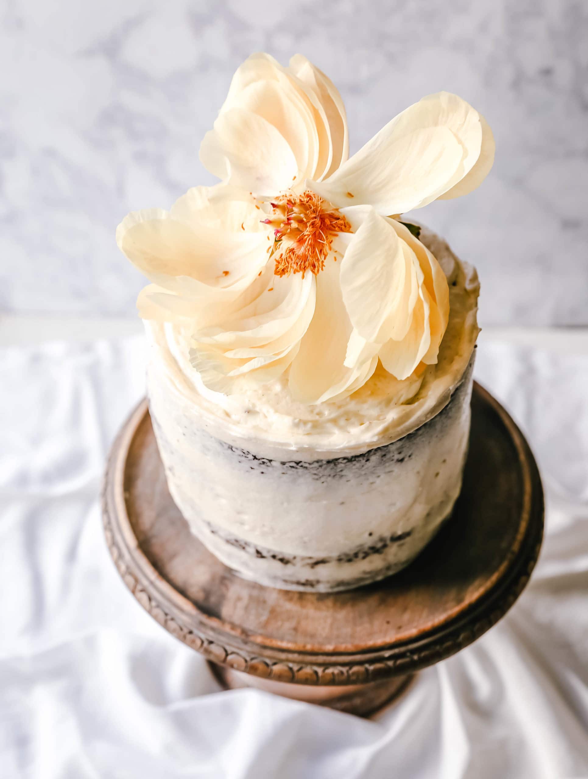 Black and White Cake -- Chocolate Cake with Vanilla Frosting Rich, moist homemade chocolate cake with a creamy vanilla bean frosting with a touch of cream cheese. The perfect Black and White Cake!