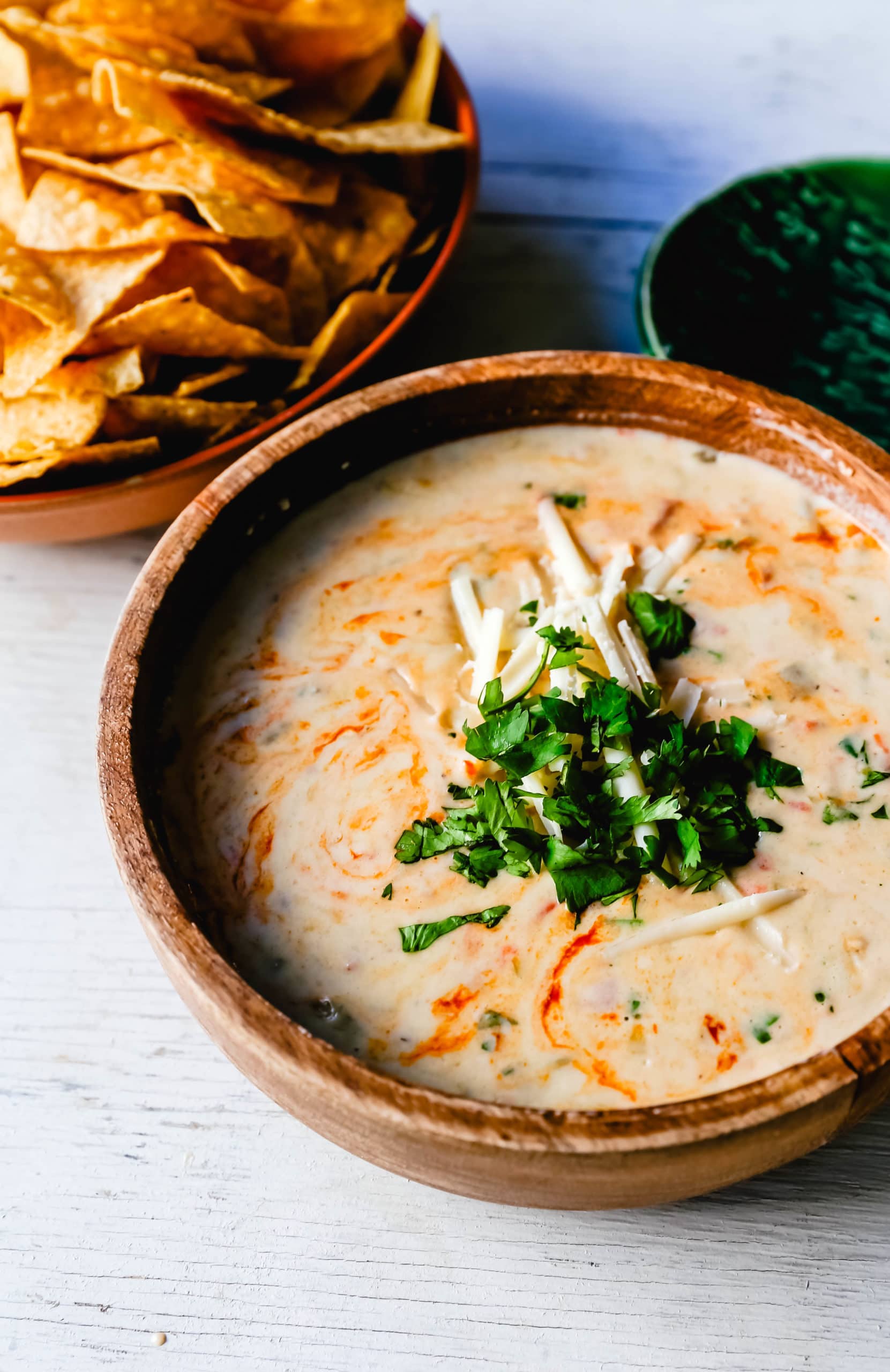 Queso Dip Creamy green chile queso blanco dip made with the perfect blend of cheeses, green chiles, fresh cilantro, and hot sauce. How to make the perfect homemade queso! #queso #cincodemayo #mexican #mexicanfood