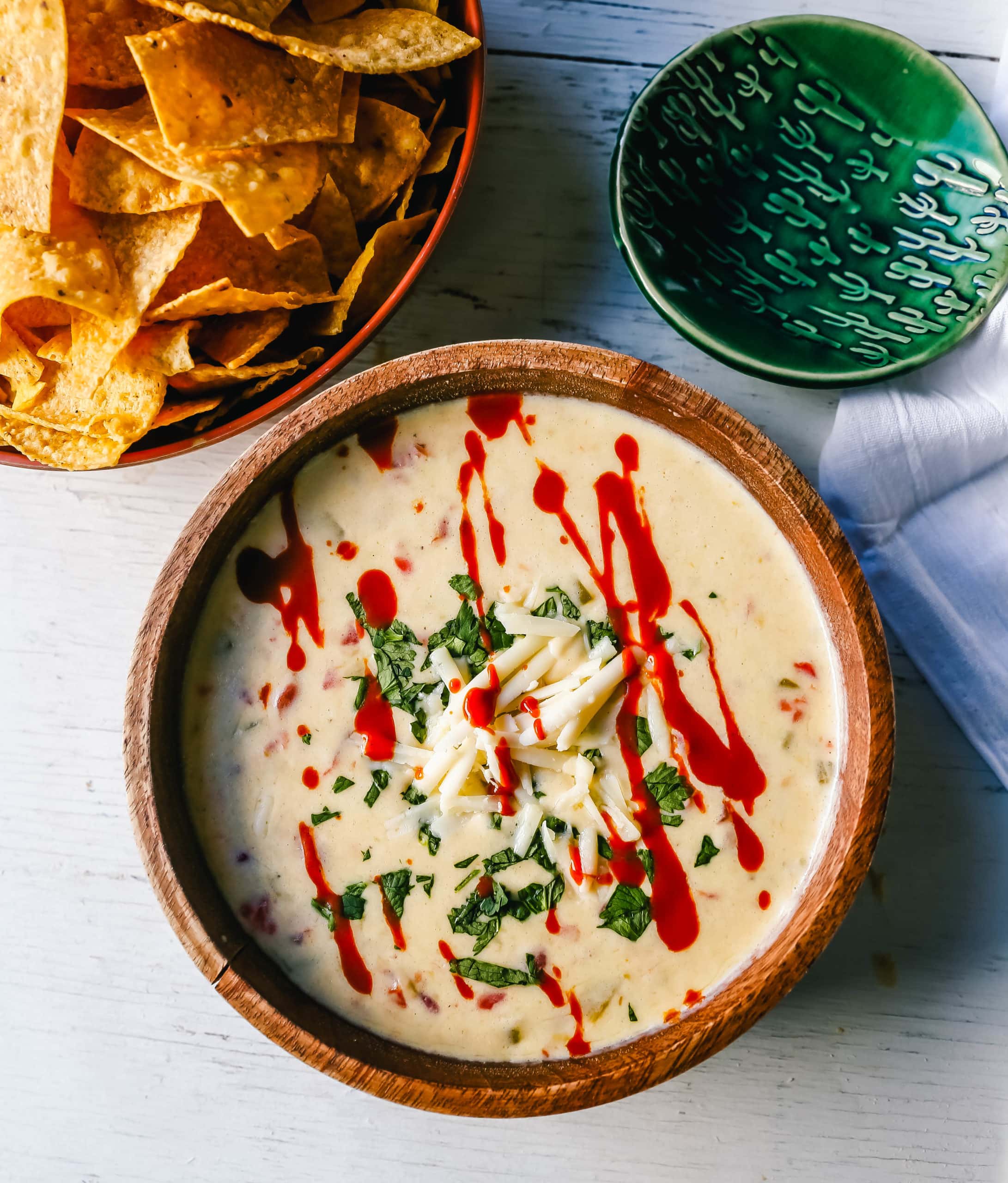 Queso Dip Creamy green chile queso blanco dip made with the perfect blend of cheeses, green chiles, fresh cilantro, and hot sauce. How to make the perfect homemade queso! #queso #cincodemayo #mexican #mexicanfood