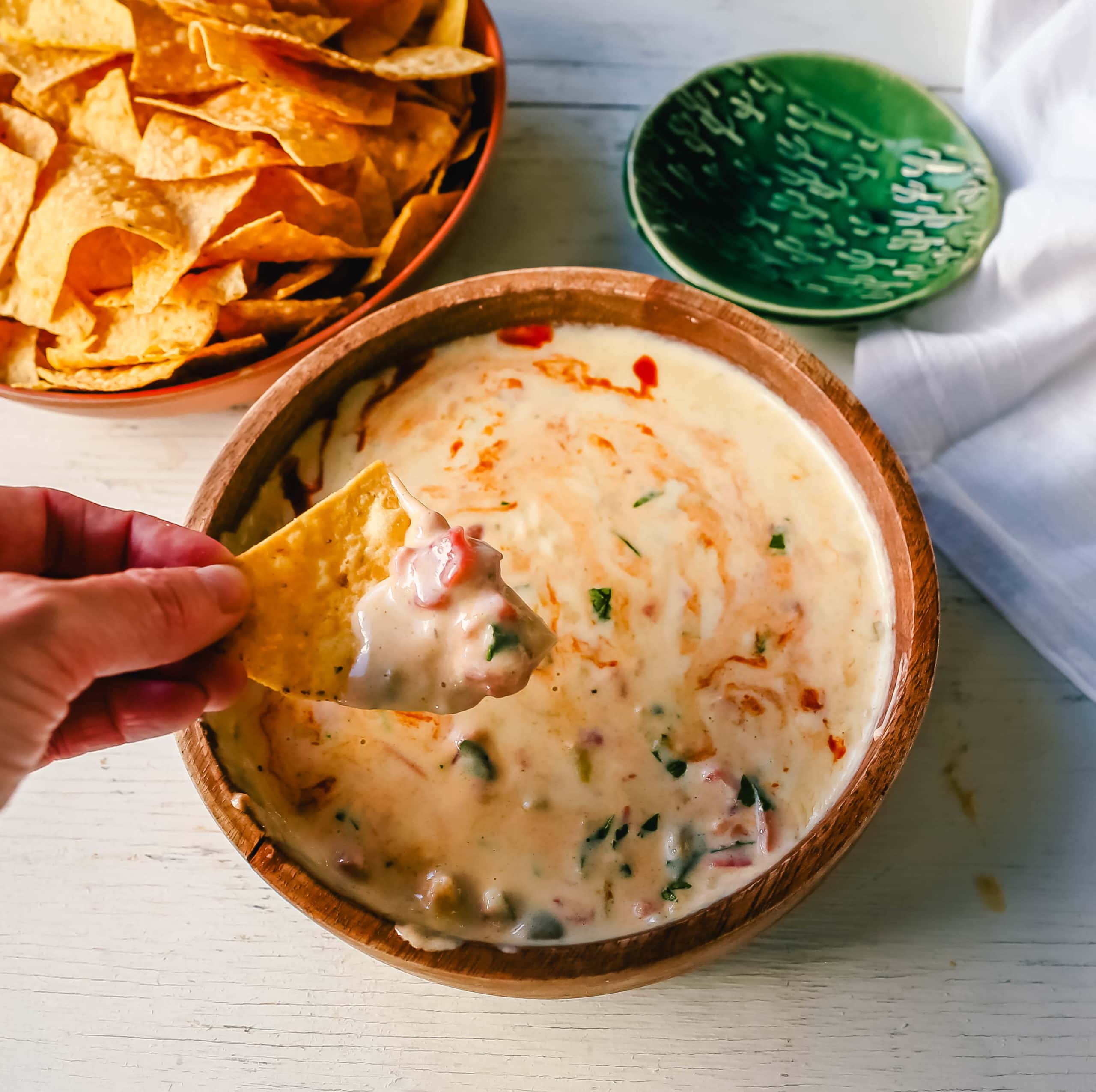 Queso Dip Creamy green chile queso blanco dip made with the perfect blend of cheeses, green chiles, fresh cilantro, and hot sauce. How to make the perfect homemade queso! #queso #cincodemayo #mexican #mexicanfood