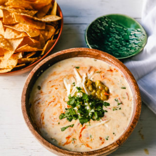 Queso Dip. Creamy green chile queso blanco dip made with the perfect blend of cheeses, green chiles, fresh cilantro, and hot sauce. How to make the perfect homemade queso! #queso #cincodemayo #mexican #mexicanfood