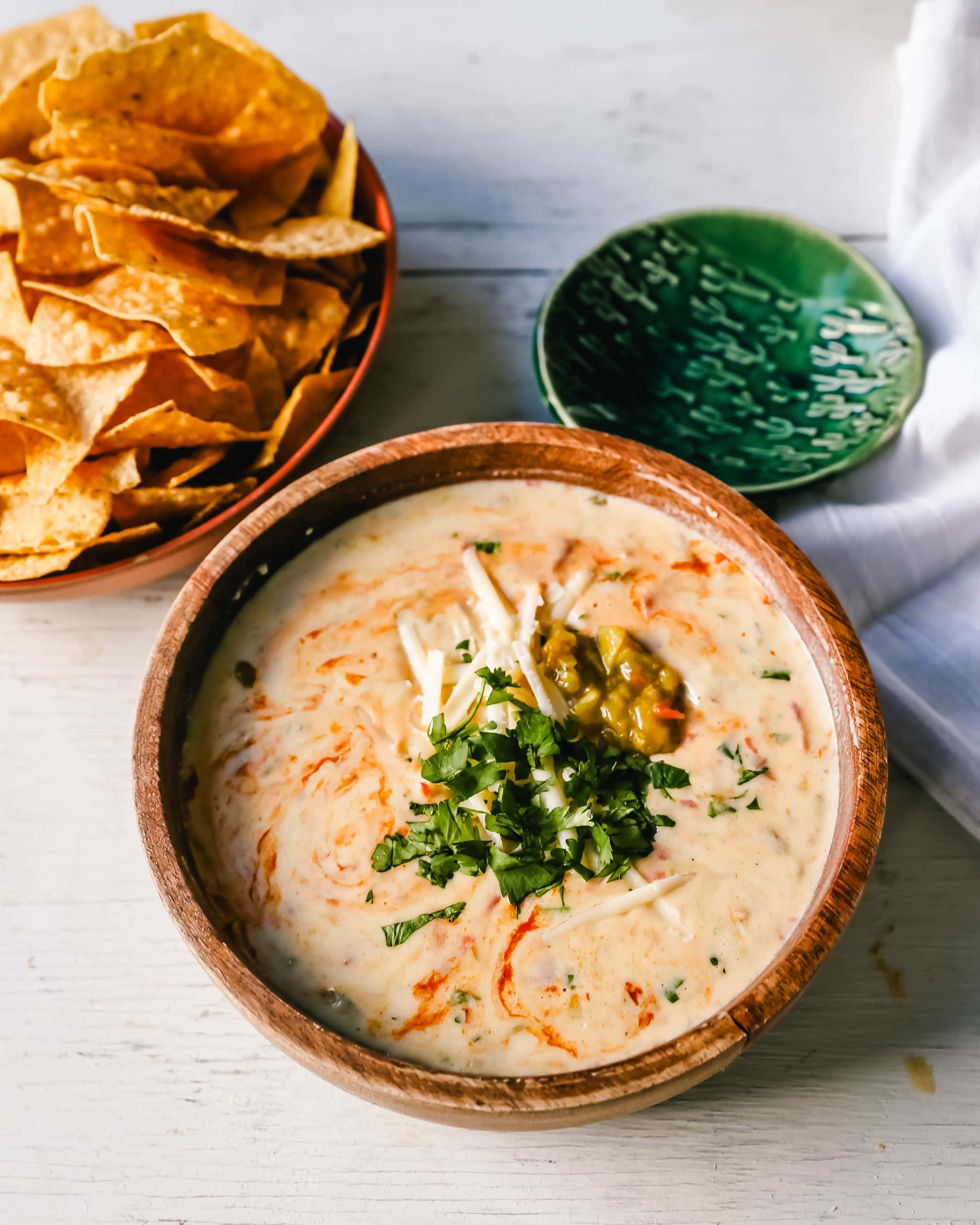 Queso Dip. Creamy green chile queso blanco dip made with the perfect blend of cheeses, green chiles, fresh cilantro, and hot sauce. How to make the perfect homemade queso! #queso #cincodemayo #mexican #mexicanfood