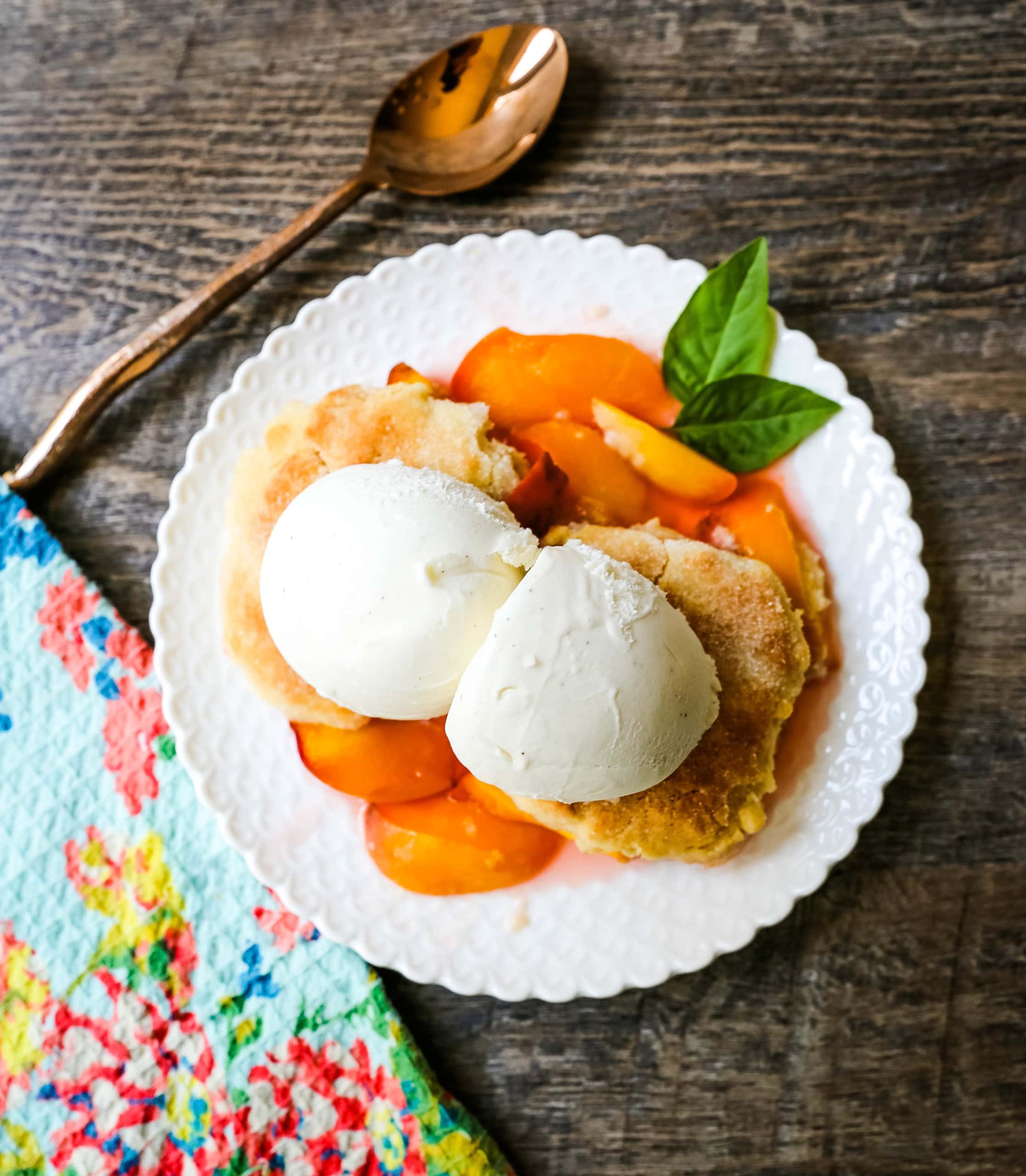 Peach Cobbler. The Best Peach Cobbler Recipe! Fresh peaches tossed with a touch of sugar and topped with a homemade sweet and buttery topping that resembles a mix of a sugar cookie and a sweet biscuit. 