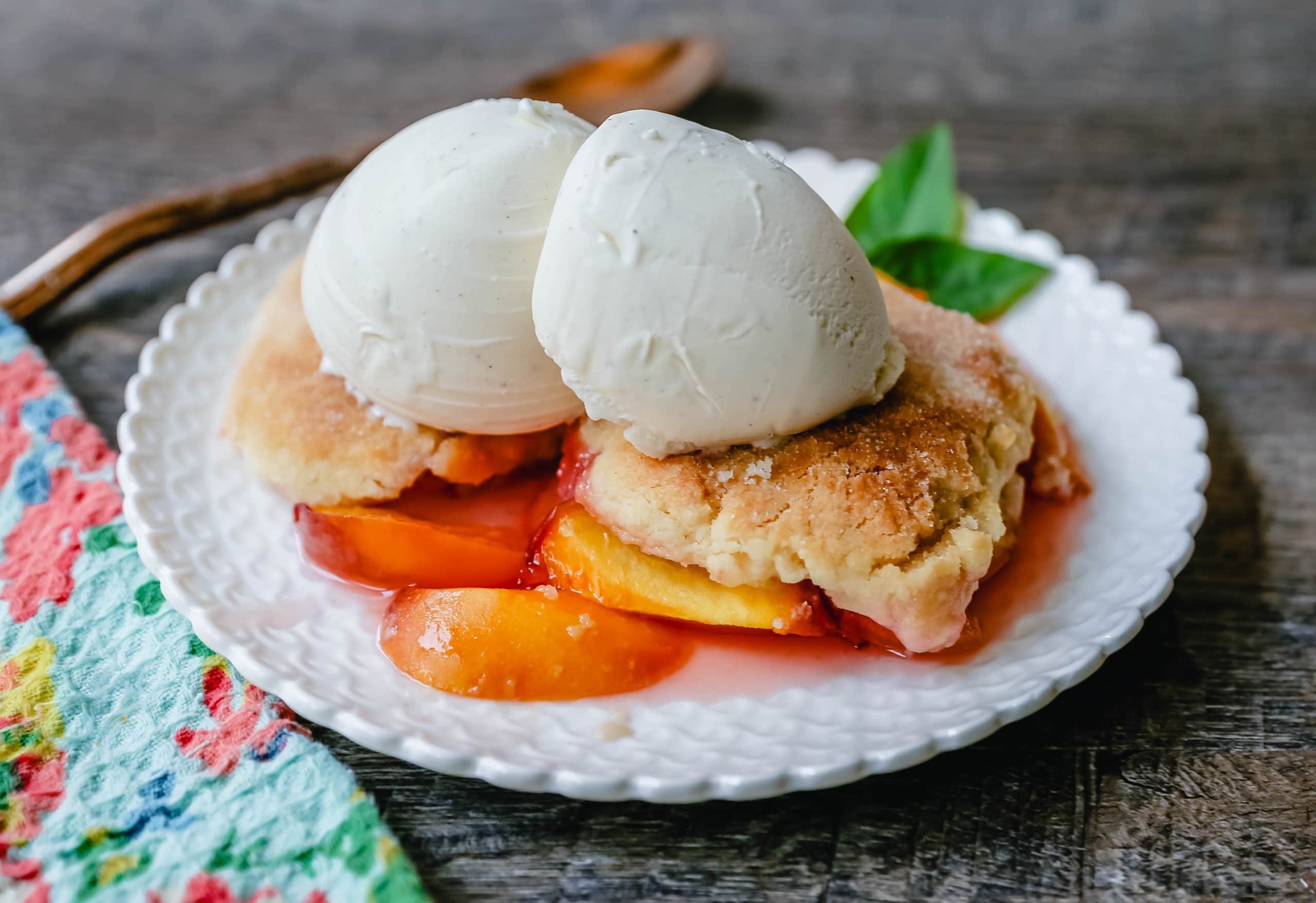 Peach Cobbler. The Best Peach Cobbler Recipe! Fresh peaches tossed with a touch of sugar and topped with a homemade sweet and buttery topping that resembles a mix of a sugar cookie and a sweet biscuit. 