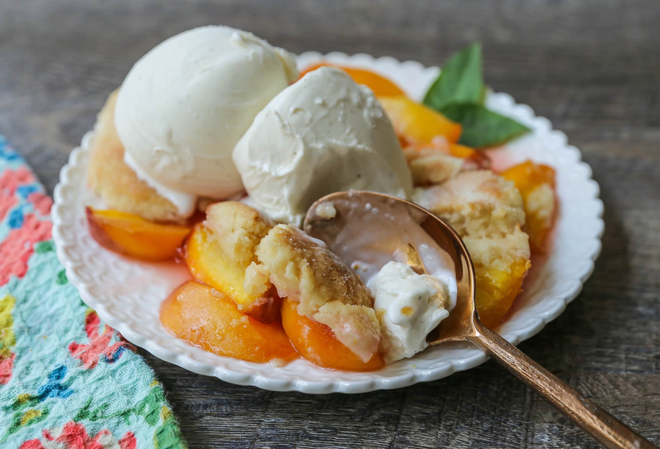 Peach Cobbler. The Best Peach Cobbler Recipe! Fresh peaches tossed with a touch of sugar and topped with a homemade sweet and buttery topping that resembles a mix of a sugar cookie and a sweet biscuit. 