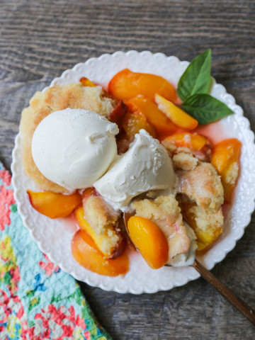 Peach Cobbler. The Best Peach Cobbler Recipe! Fresh peaches tossed with a touch of sugar and topped with a homemade sweet and buttery topping that resembles a mix of a sugar cookie and a sweet biscuit. 