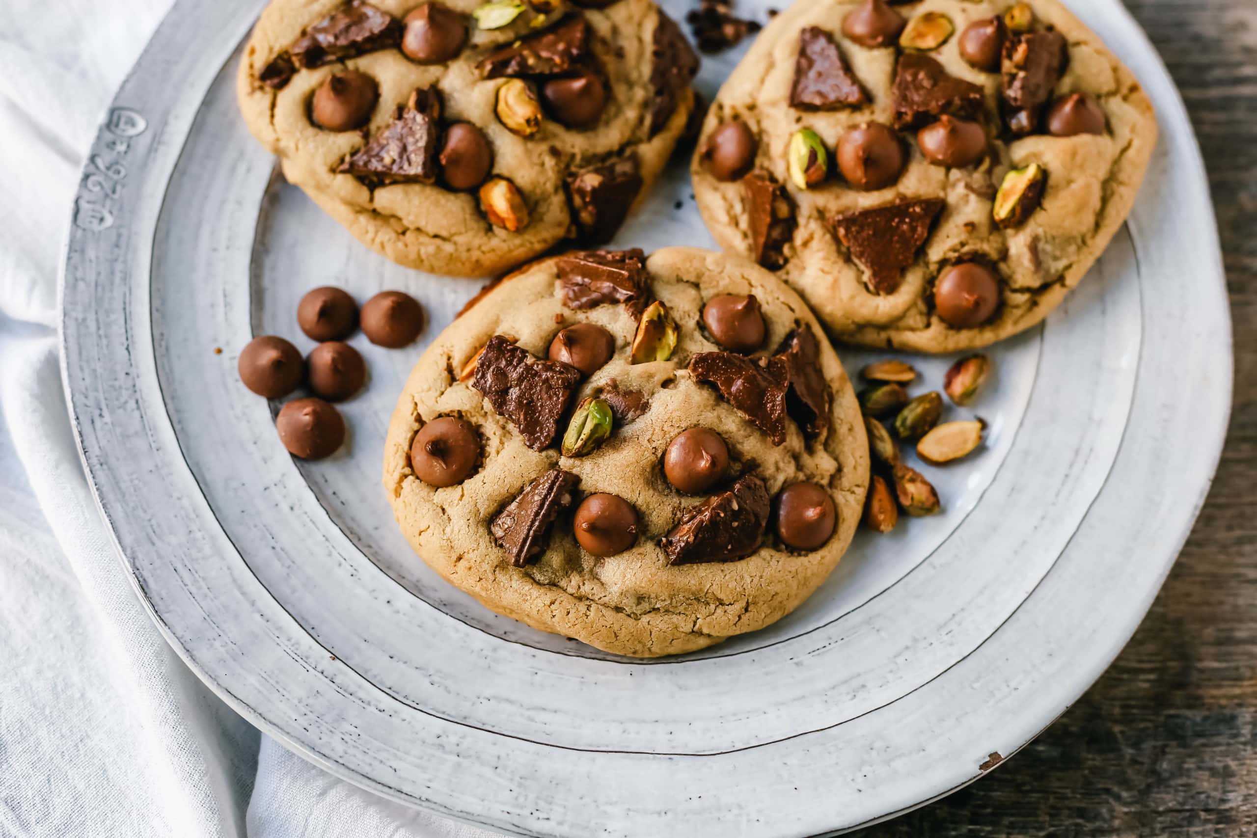 Pistachio Toffee Chocolate Chip Cookies Thick, chewy bakery-style cookies with milk chocolate toffee, pistachios, and milk chocolate chips. A sweet and salty cookie!