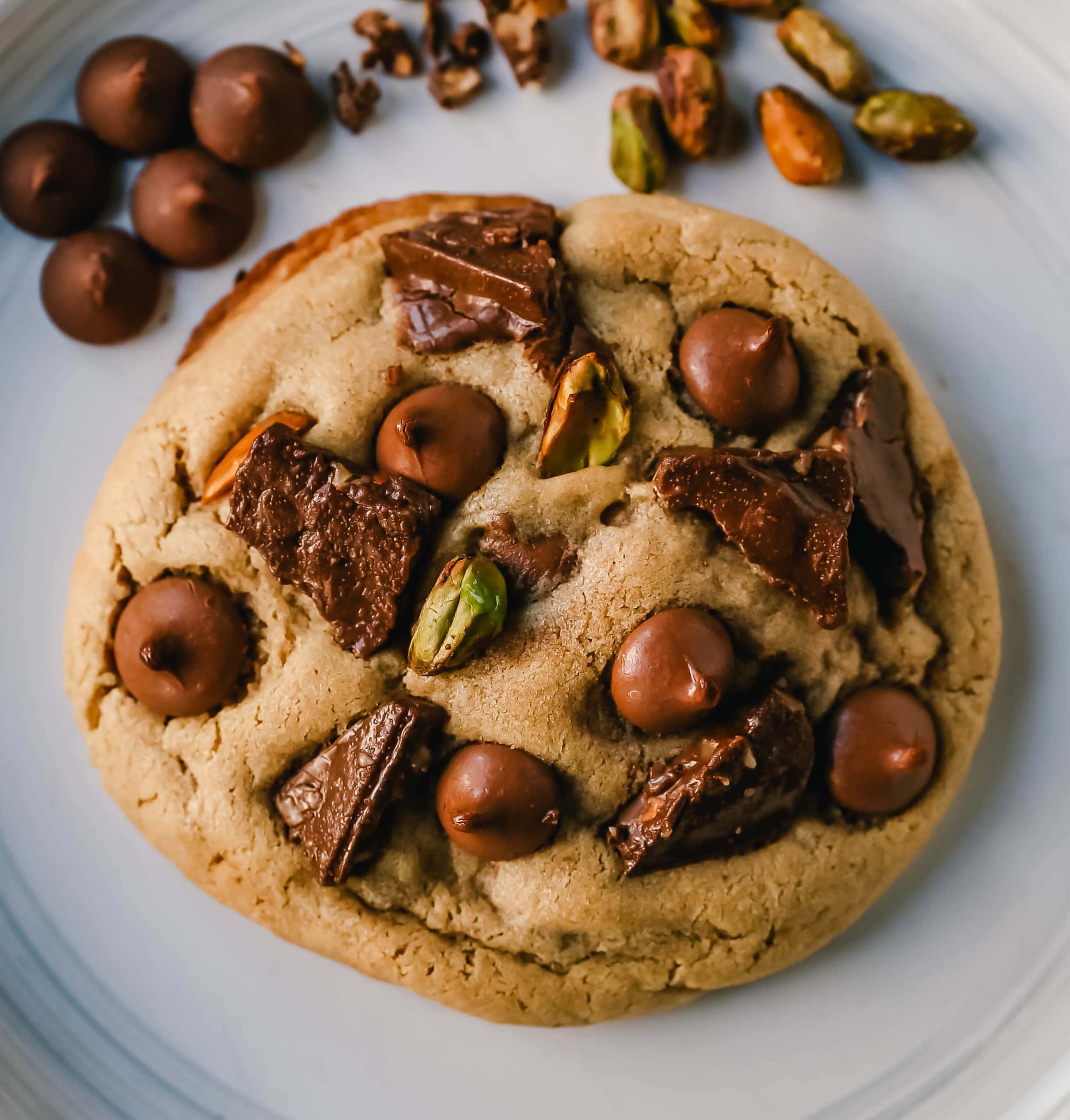 Pistachio Toffee Chocolate Chip Cookies Thick, chewy bakery-style cookies with milk chocolate toffee, pistachios, and milk chocolate chips. A sweet and salty cookie!