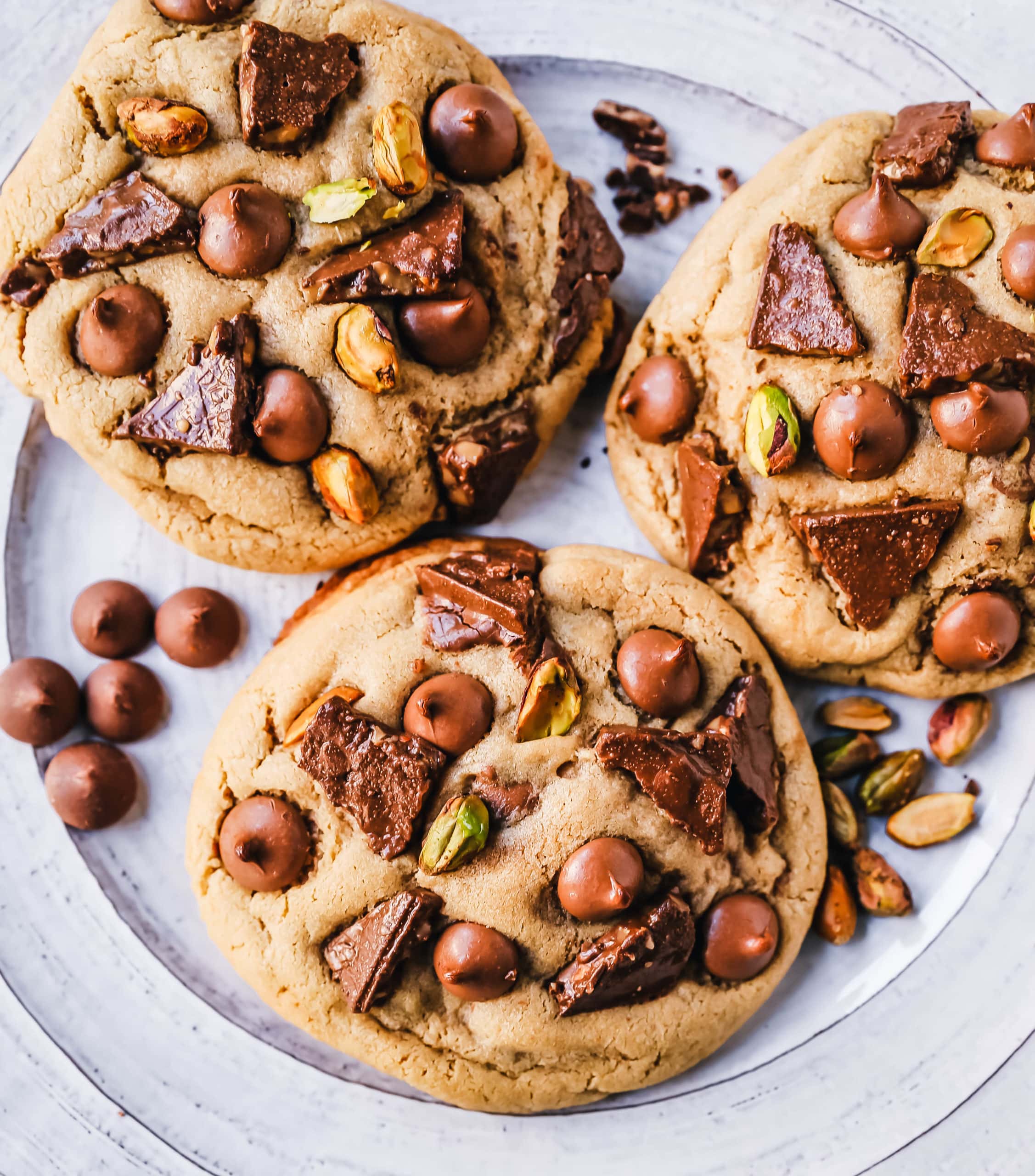 Pistachio Toffee Chocolate Chip Cookies Thick, chewy bakery-style cookies with milk chocolate toffee, pistachios, and milk chocolate chips. A sweet and salty cookie!