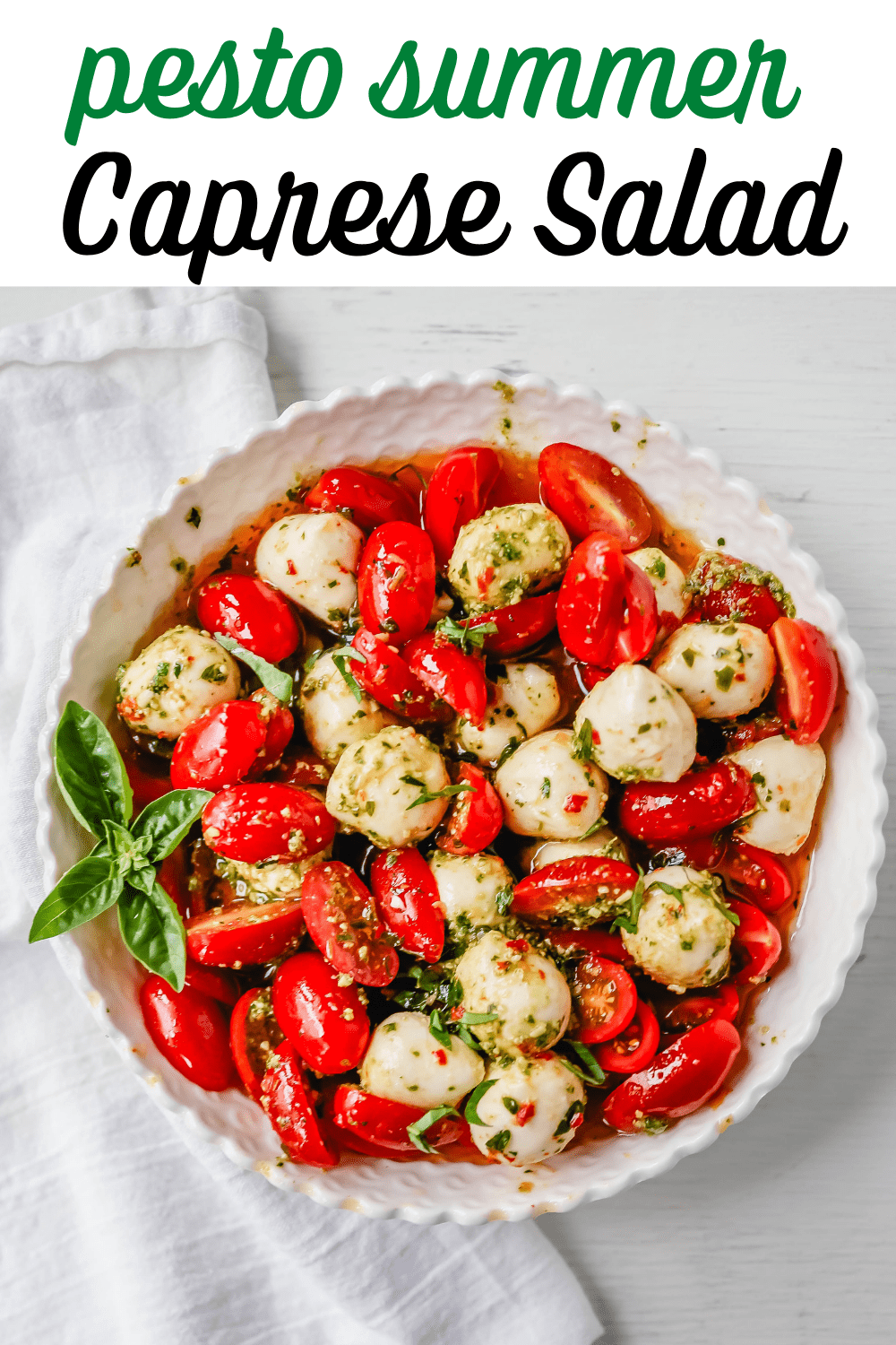 Pesto Caprese Salad Fresh cherry or grape tomatoes, vibrant pesto sauce, creamy fresh mozzarella balls, extra-virgin olive oil, balsamic glaze, basil, and spices. A perfect summer salad recipe!