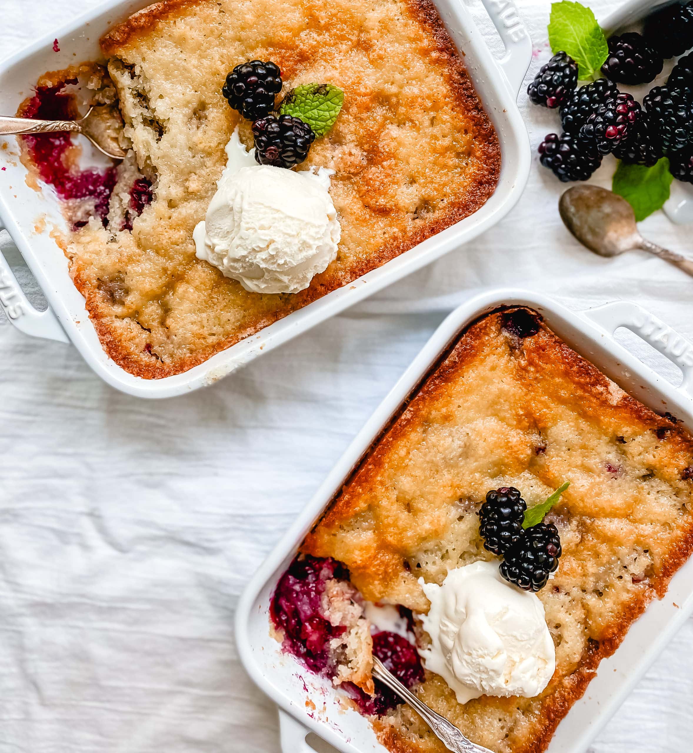 Blackberry Cobbler. A Texas favorite! This Blackberry Cobbler is made with a sweet, buttery crust with fresh sweetened blackberries and topped with vanilla bean ice cream. The perfect summer dessert recipe!