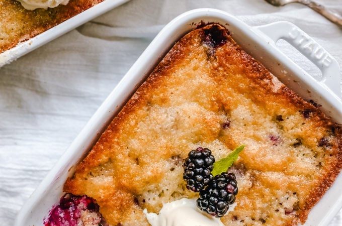 Blackberry Cobbler. A Texas favorite! This Blackberry Cobbler is made with a sweet, buttery crust with fresh sweetened blackberries and topped with vanilla bean ice cream. The perfect summer dessert recipe!