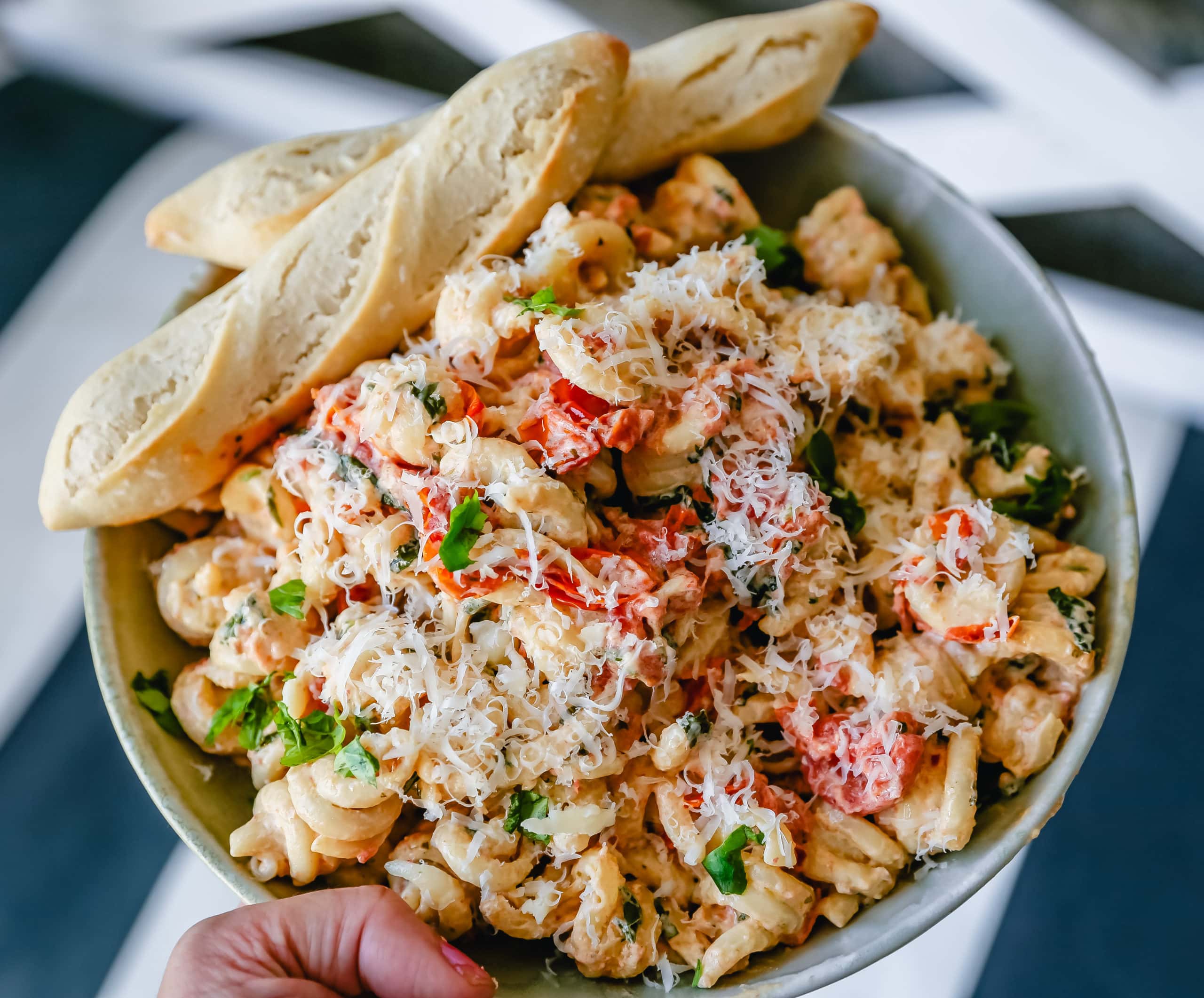 Boursin Cheese Baked TikTok Pasta Freshly cooked pasta tossed with baked Boursin cheese, tomatoes, garlic, spices, and parmesan cheese. This easy-baked pasta recipe will knock your socks off! #pasta #bakedpasta #tiktokpasta