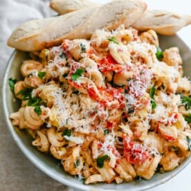 Boursin Cheese Baked TikTok Pasta Freshly cooked pasta tossed with baked Boursin cheese, tomatoes, garlic, spices, and parmesan cheese. This easy-baked pasta recipe will knock your socks off! #pasta #bakedpasta #tiktokpasta