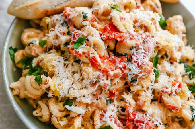 Boursin Cheese Baked TikTok Pasta Freshly cooked pasta tossed with baked Boursin cheese, tomatoes, garlic, spices, and parmesan cheese. This easy-baked pasta recipe will knock your socks off! #pasta #bakedpasta #tiktokpasta