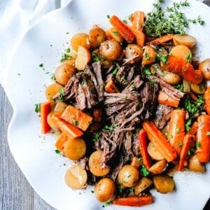 Beef Pot Roast Tender, slow-cooked, flavorful beef pot roast with golden potatoes and savory carrots. How to make the most flavorful, moist, and tender pot roast at home.