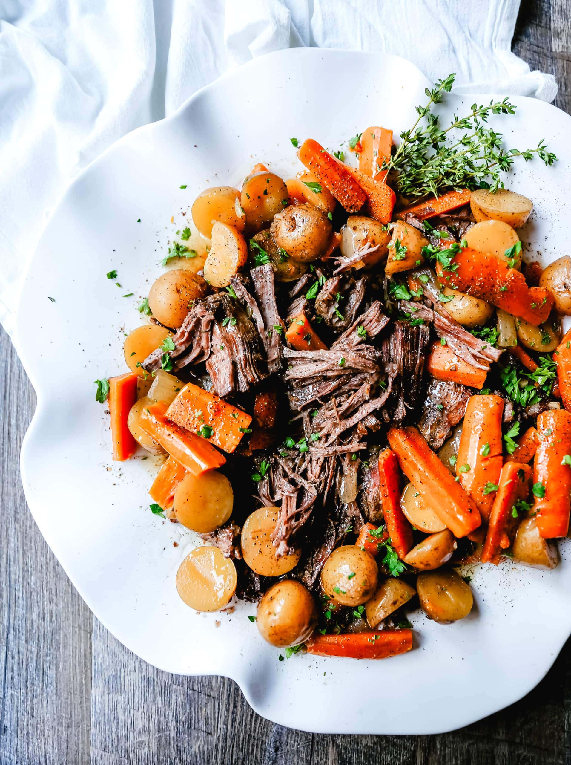 Beef Pot Roast Tender, slow-cooked, flavorful beef pot roast with golden potatoes and savory carrots. How to make the most flavorful, moist, and tender pot roast at home.