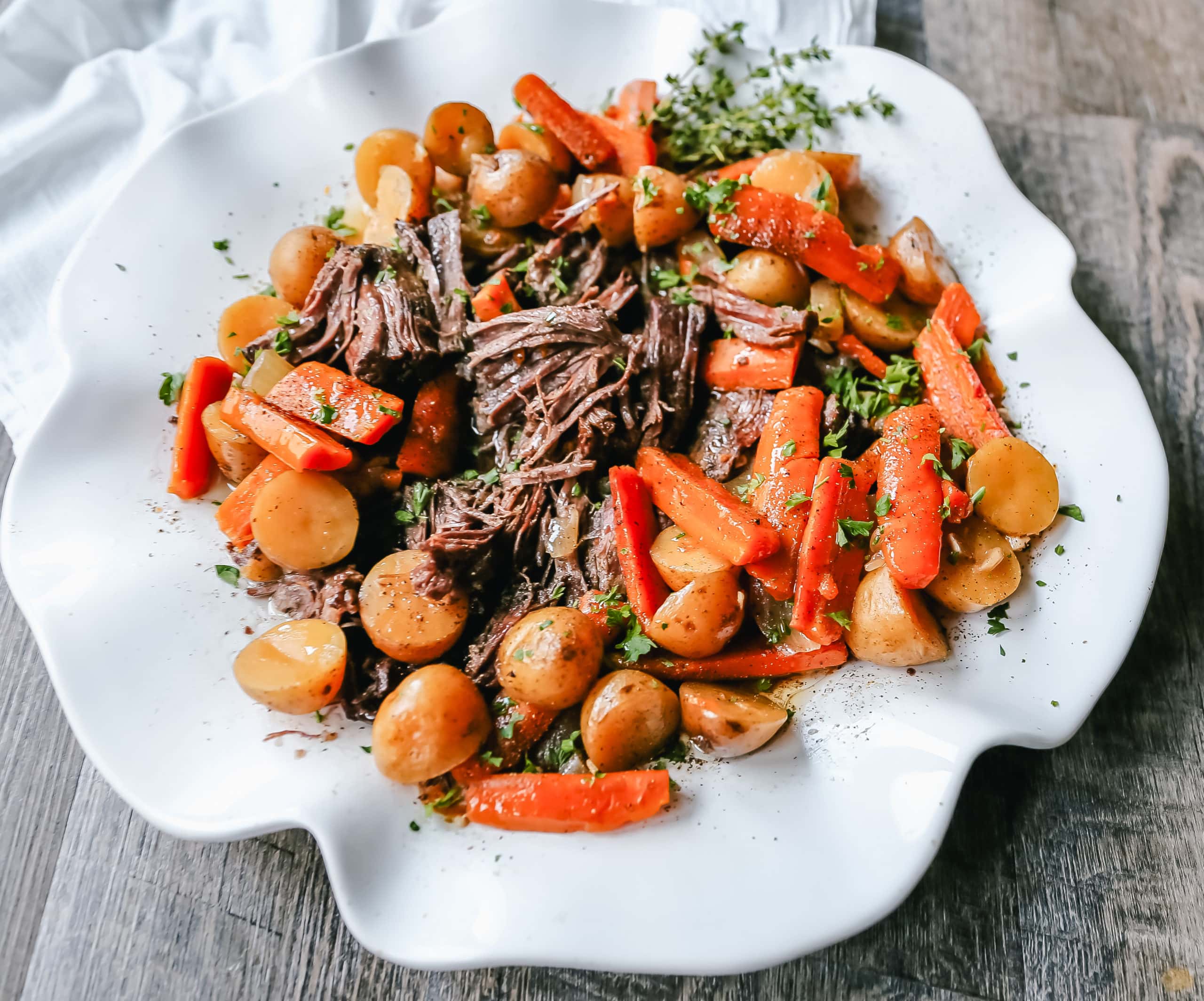 Beef Pot Roast Tender, slow-cooked, flavorful beef pot roast with golden potatoes and savory carrots. How to make the most flavorful, moist, and tender pot roast at home.