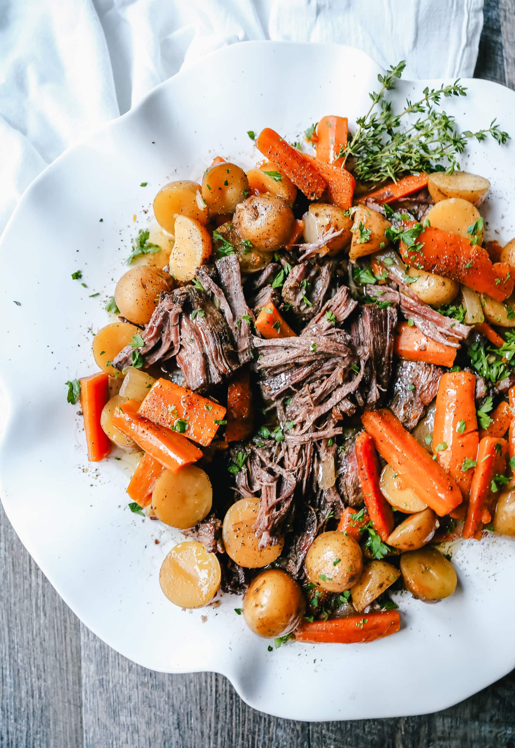 Beef Pot Roast Tender, slow-cooked, flavorful beef pot roast with golden potatoes and savory carrots. How to make the most flavorful, moist, and tender pot roast at home.