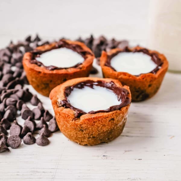 Milk and Cookie Shots The famous Milk and Cookie Shots were made famous at New York City Dominique Ansel Bakery. This soft chocolate chip cookie is shaped into a shot, baked until warm and gooey, lined with chocolate, and served with milk inside. If you love cookies and milk, this is the dessert for you!