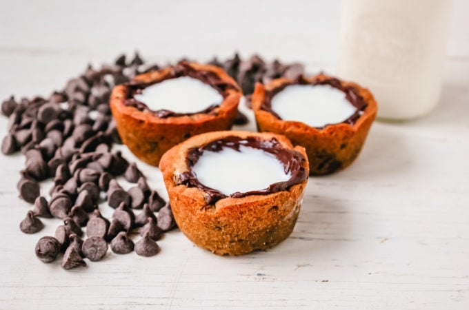 Milk and Cookie Shots The famous Milk and Cookie Shots were made famous at New York City Dominique Ansel Bakery. This soft chocolate chip cookie is shaped into a shot, baked until warm and gooey, lined with chocolate, and served with milk inside. If you love cookies and milk, this is the dessert for you!