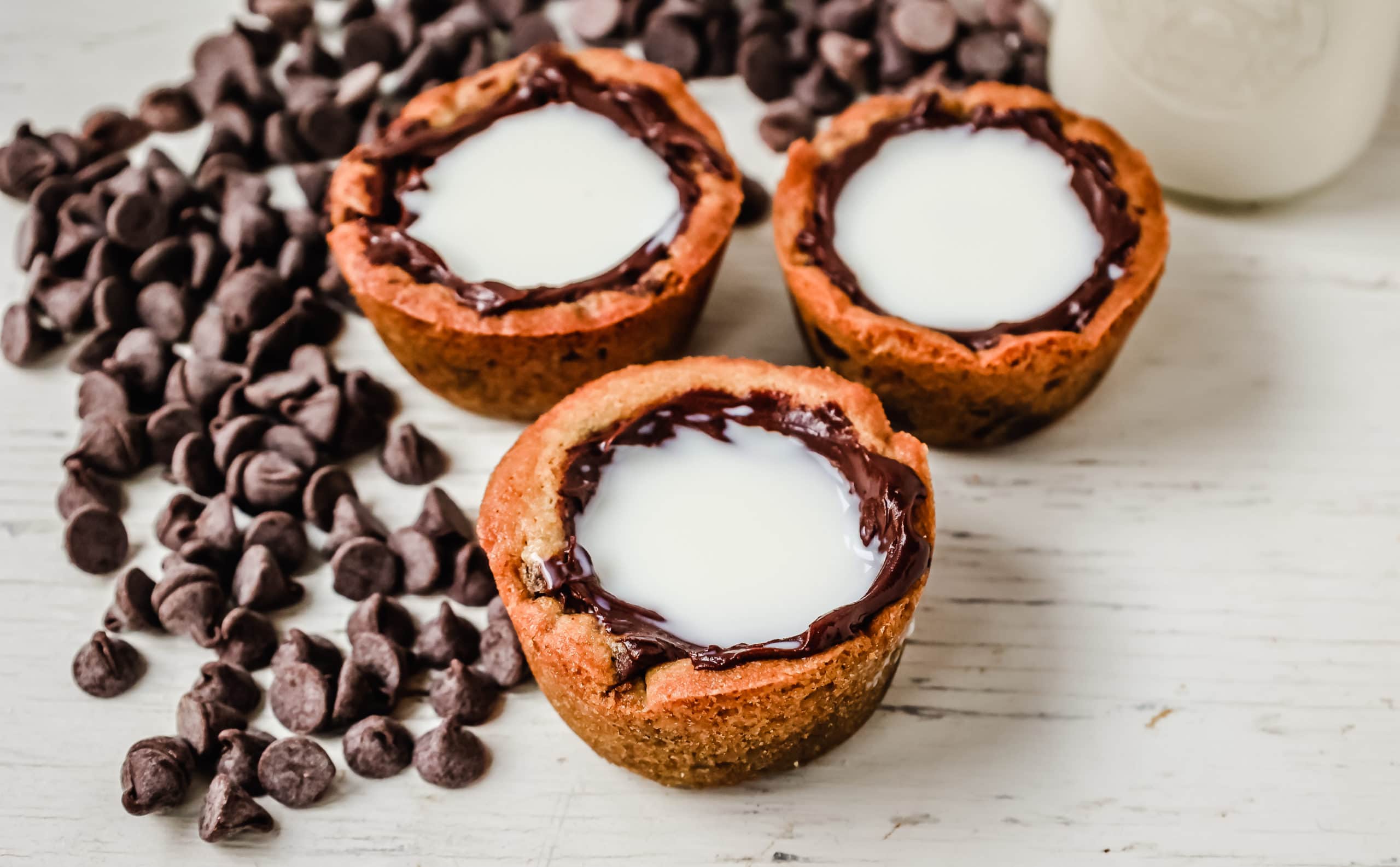 Milk and Cookie Shots The famous Milk and Cookie Shots were made famous at New York City Dominique Ansel Bakery. This soft chocolate chip cookie is shaped into a shot, baked until warm and gooey, lined with chocolate, and served with milk inside. If you love cookies and milk, this is the dessert for you!