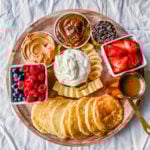 Breakfast Pancake Board. The perfect breakfast for entertaining! Homemade buttermilk pancakes topped with all of your favorite toppings -- fresh berries, whipped cream, homemade syrup, Nutella, chocolate chips, peanut butter, and more. 