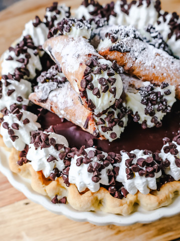 Best Cannoli Pie Recipe. The popular Italian dessert -- the famous Cannoli -- but made into a pie. A creamy sweet ricotta and cream cheese filling with mini chocolate chips, topped with chocolate ganache, and freshly whipped cream.