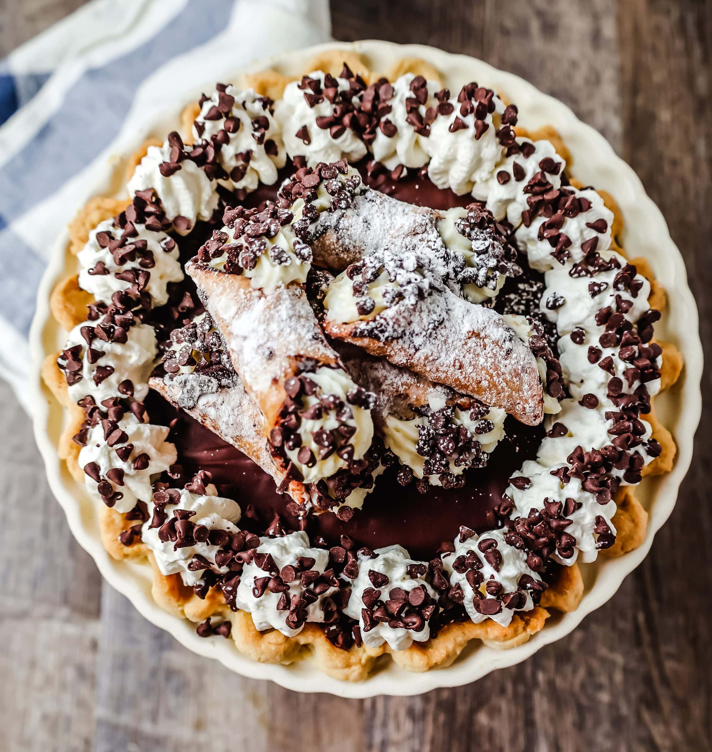 Best Cannoli Pie Recipe The popular Italian dessert -- the famous Cannoli -- but made into a pie. A creamy sweet ricotta and cream cheese filling with mini chocolate chips, topped with chocolate ganache, and freshly whipped cream.