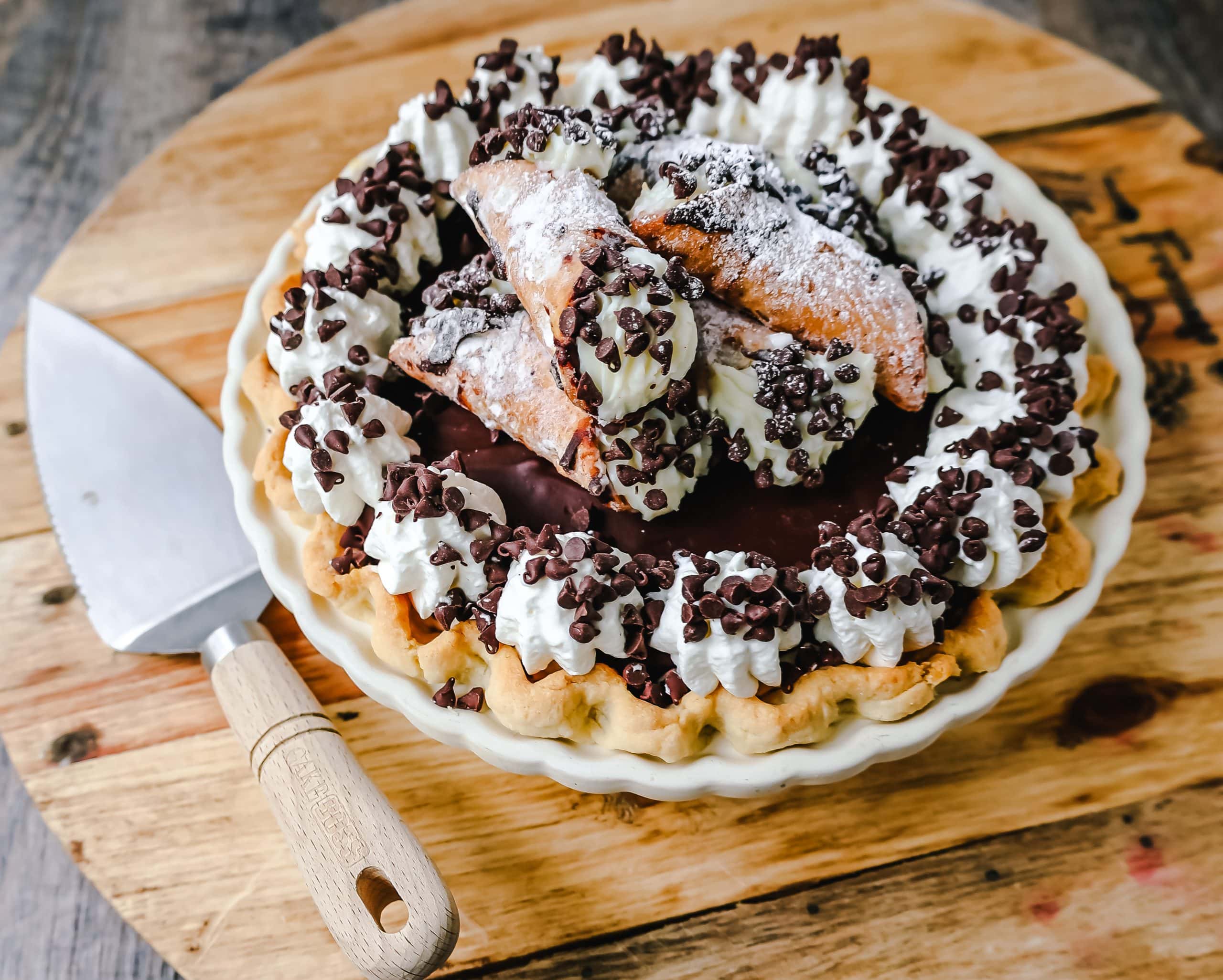 Best Cannoli Pie Recipe The popular Italian dessert -- the famous Cannoli -- but made into a pie. A creamy sweet ricotta and cream cheese filling with mini chocolate chips, topped with chocolate ganache, and freshly whipped cream.