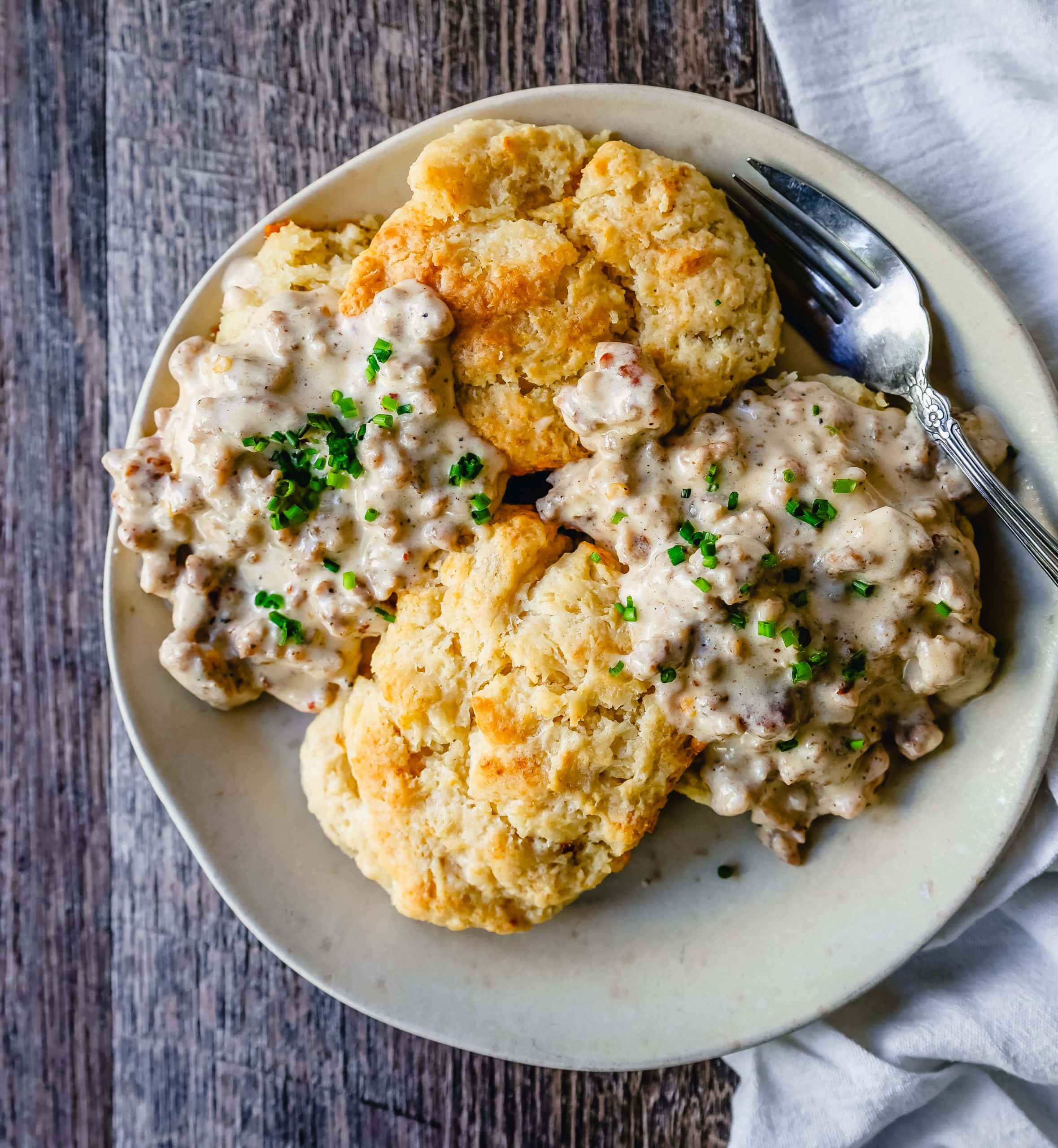 Homemade Biscuits and Gravy Buttery, flaky homemade biscuits topped with a creamy, savory sausage gravy. The best biscuits and gravy recipe!