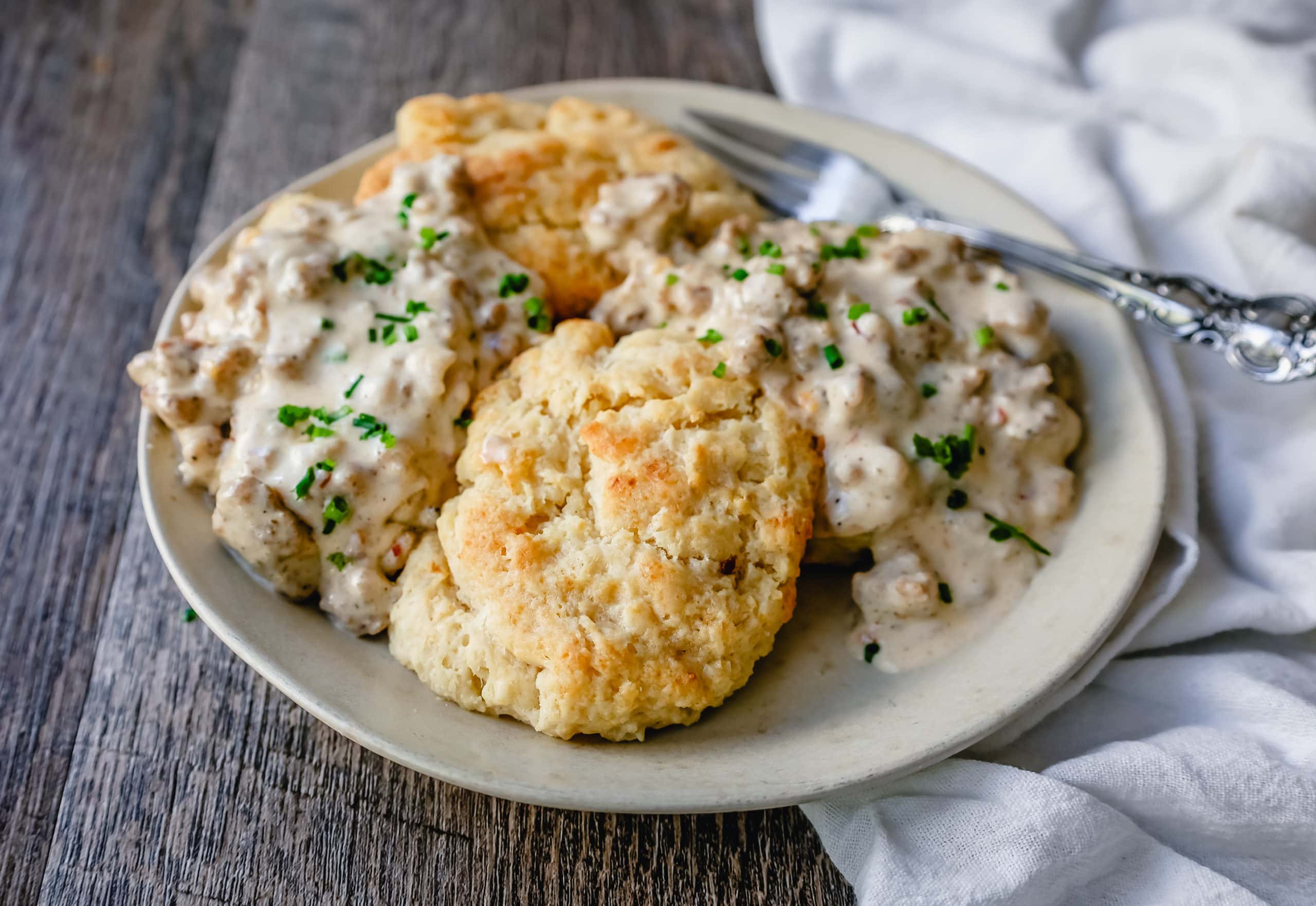 Homemade Biscuits and Gravy Buttery, flaky homemade biscuits topped with a creamy, savory sausage gravy. The best biscuits and gravy recipe!