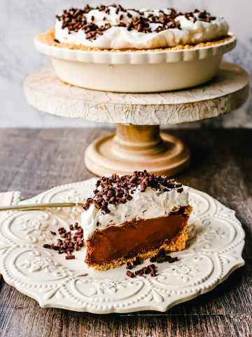 French Silk Pie Rich, creamy chocolate cream topped with fresh whipped cream and chocolate shaving all in a buttery graham cracker crust.