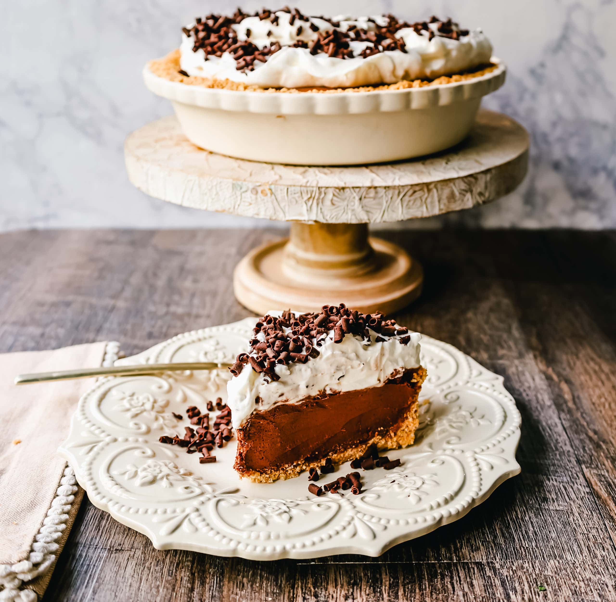 French Silk Pie Rich, creamy chocolate cream topped with fresh whipped cream and chocolate shaving all in a buttery graham cracker crust.